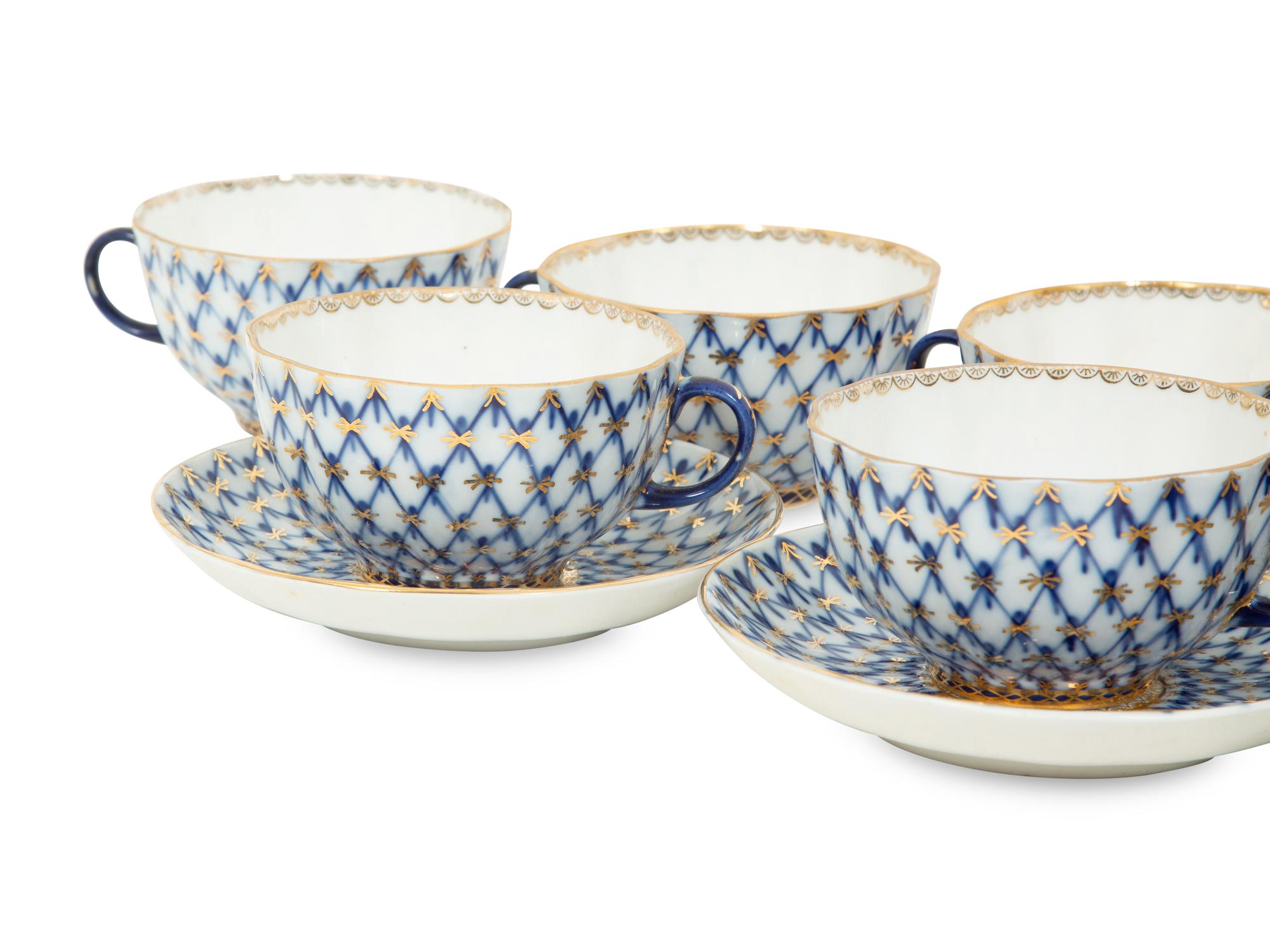 A Set of Twelve Lomonosov Cobalt Net Porcelain Teacups and Saucers