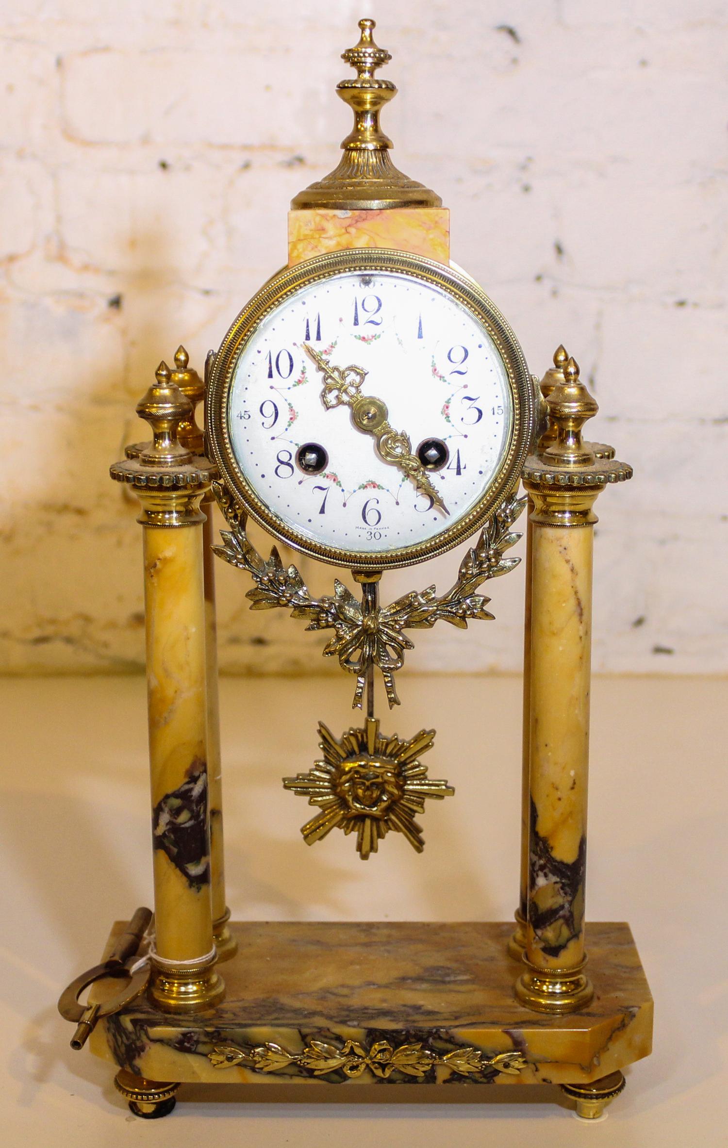 A Marble and Gilt Metal Mantle Clock. Height 15 inches.
