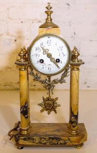 A Marble and Gilt Metal Mantle Clock. Height 15 inches.