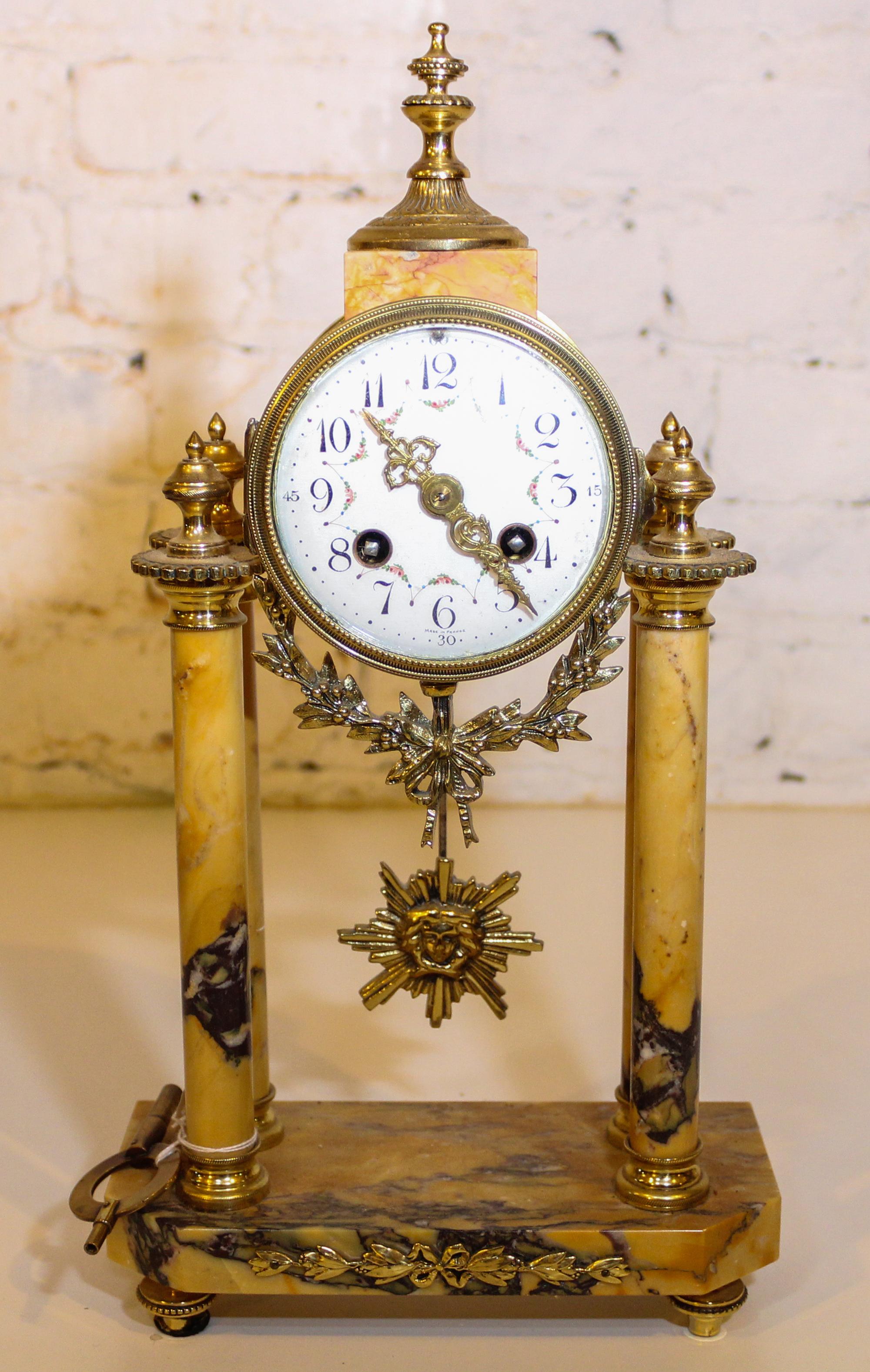 A Marble and Gilt Metal Mantle Clock. Height 15 inches.