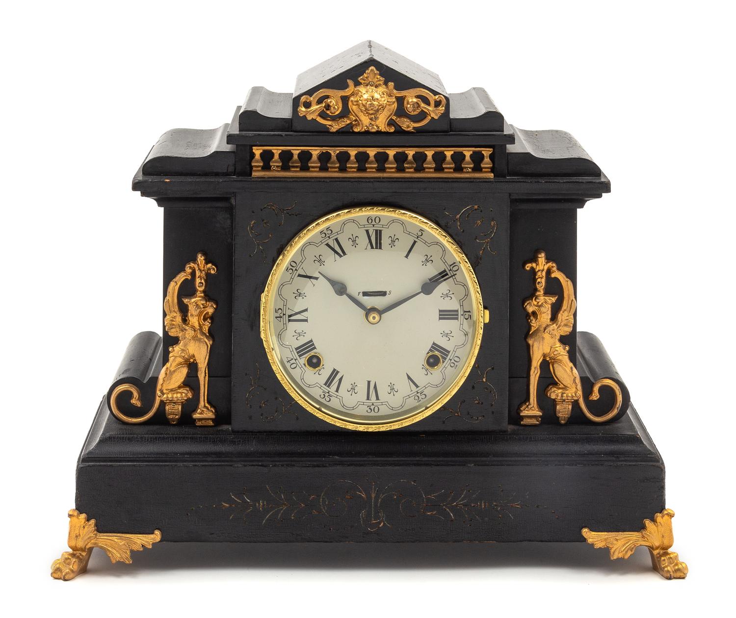 A Gilt Metal Mounted Ebonized Mantel Clock