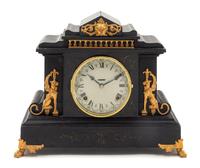 A Gilt Metal Mounted Ebonized Mantel Clock