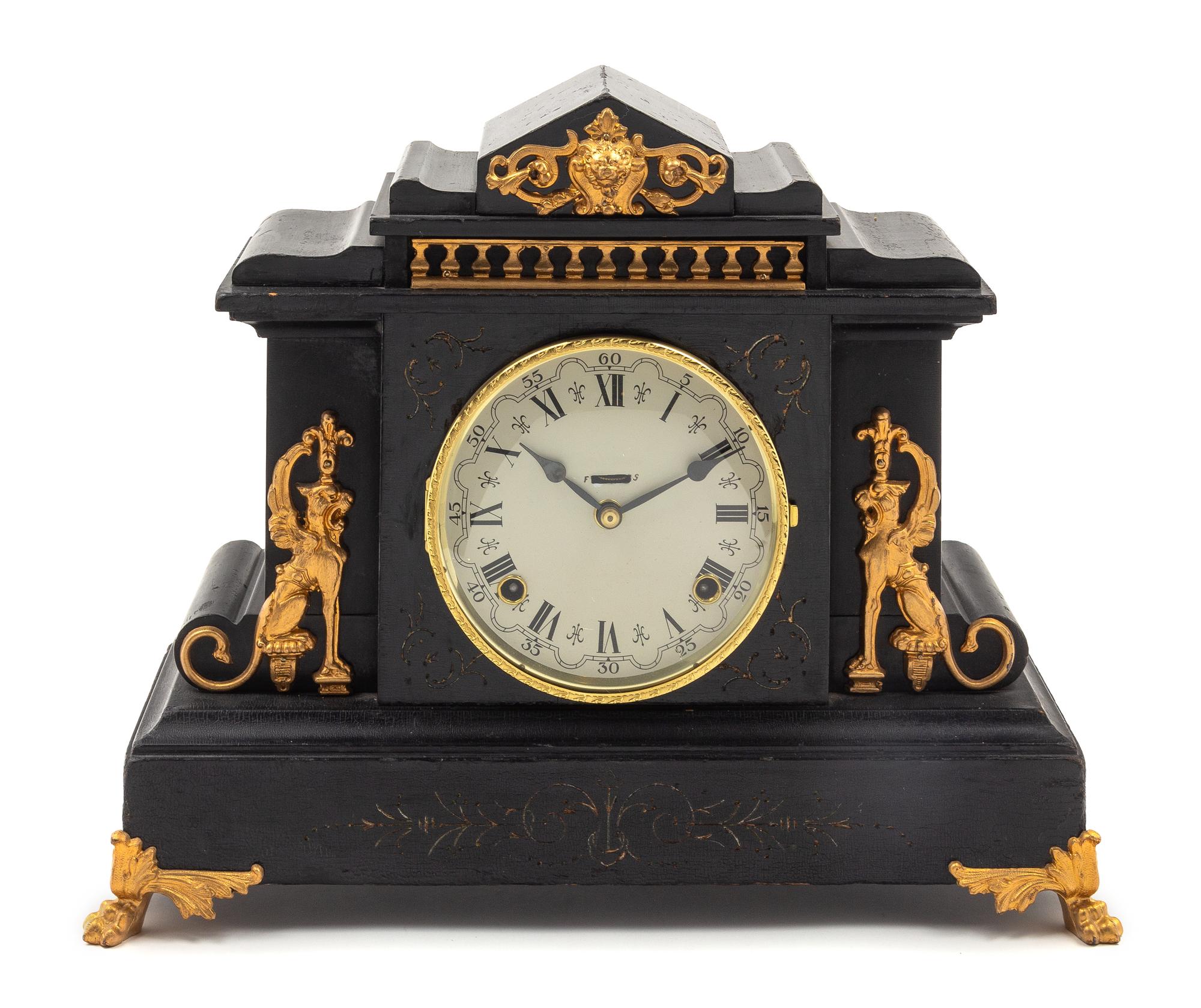 A Gilt Metal Mounted Ebonized Mantel Clock
