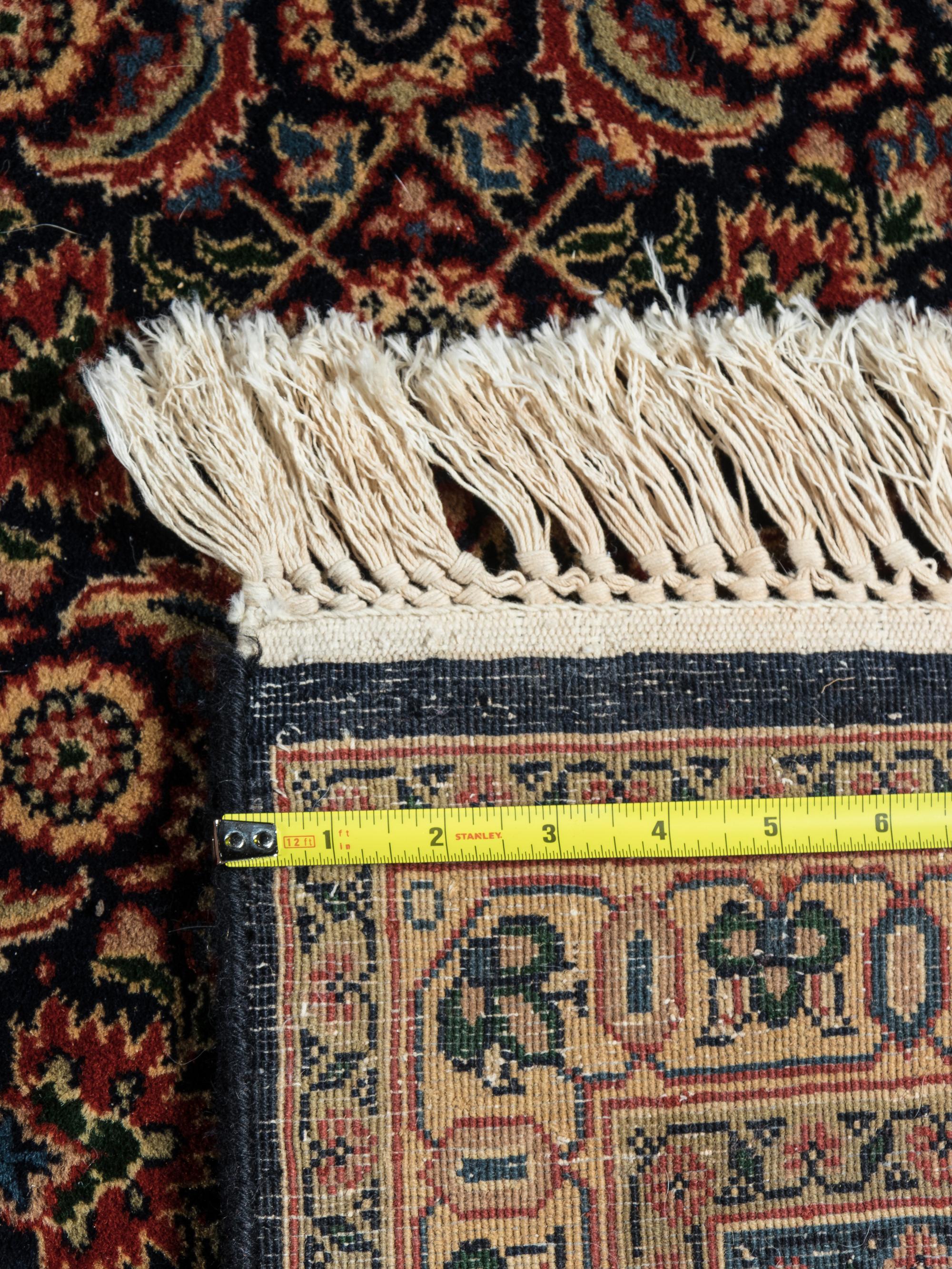 A Persian Meshed Wool Rug