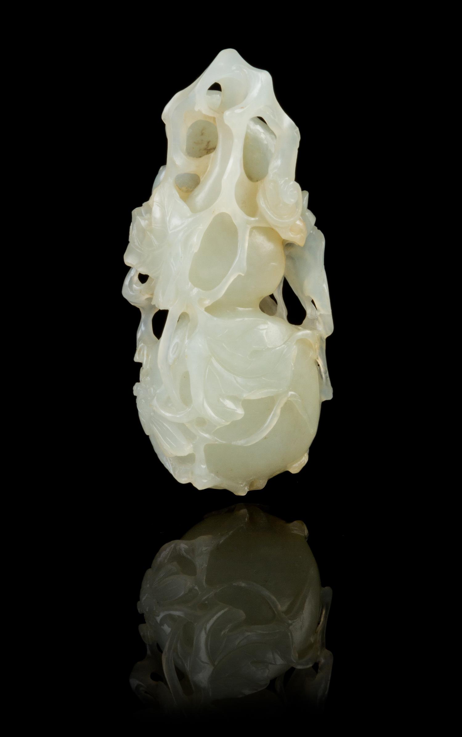 A Chinese Light Celadon Jade Double Gourd Toggle 18TH/19TH CENTURY Length 2 7/8 inches. — 18TH/19TH CENTURY