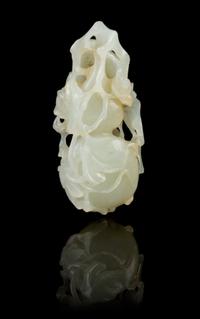 A Chinese Light Celadon Jade Double Gourd Toggle 18TH/19TH CENTURY Length 2 7/8 inches. — 18TH/19TH CENTURY