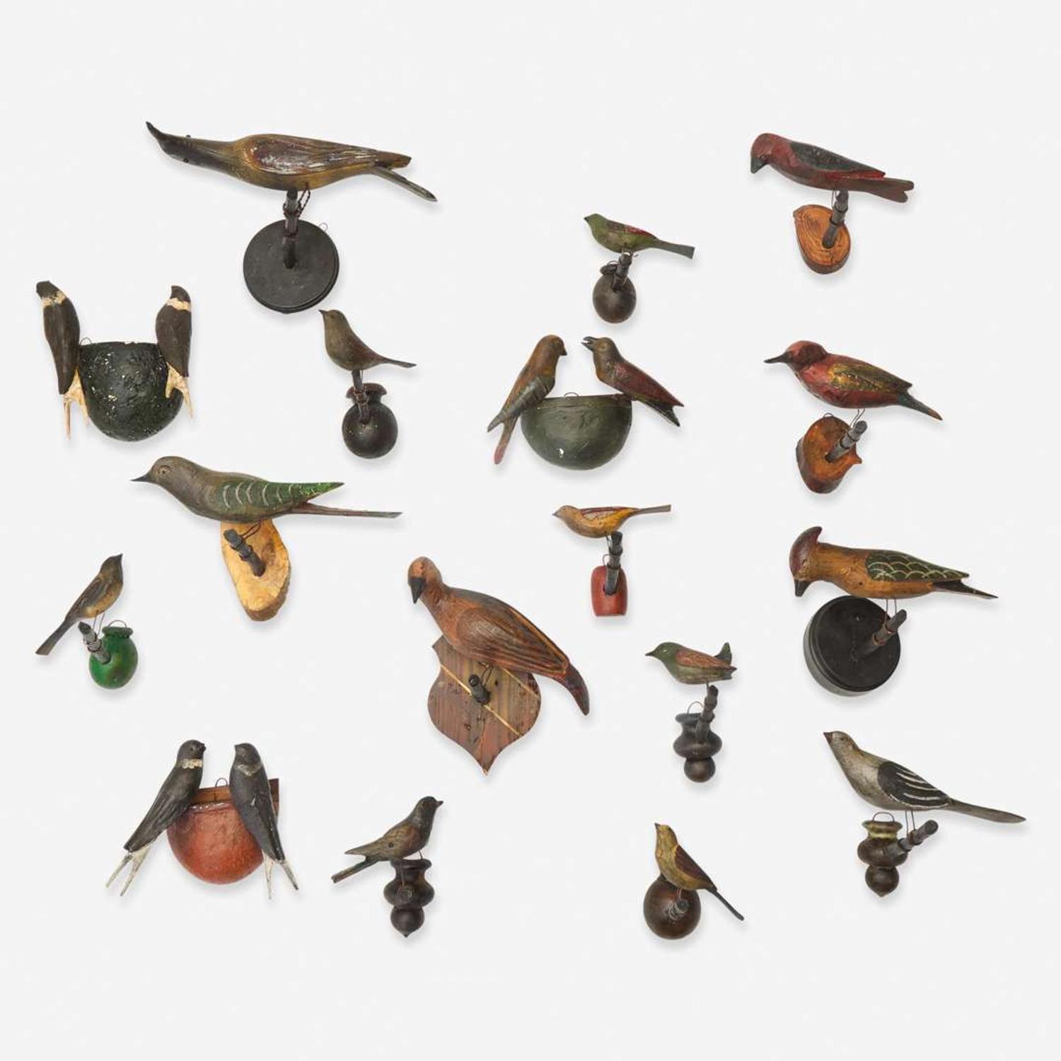 A group of seventeen carved and painted wood birds or bird groups