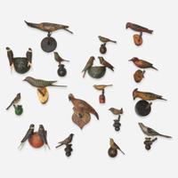 A group of seventeen carved and painted wood birds or bird groups