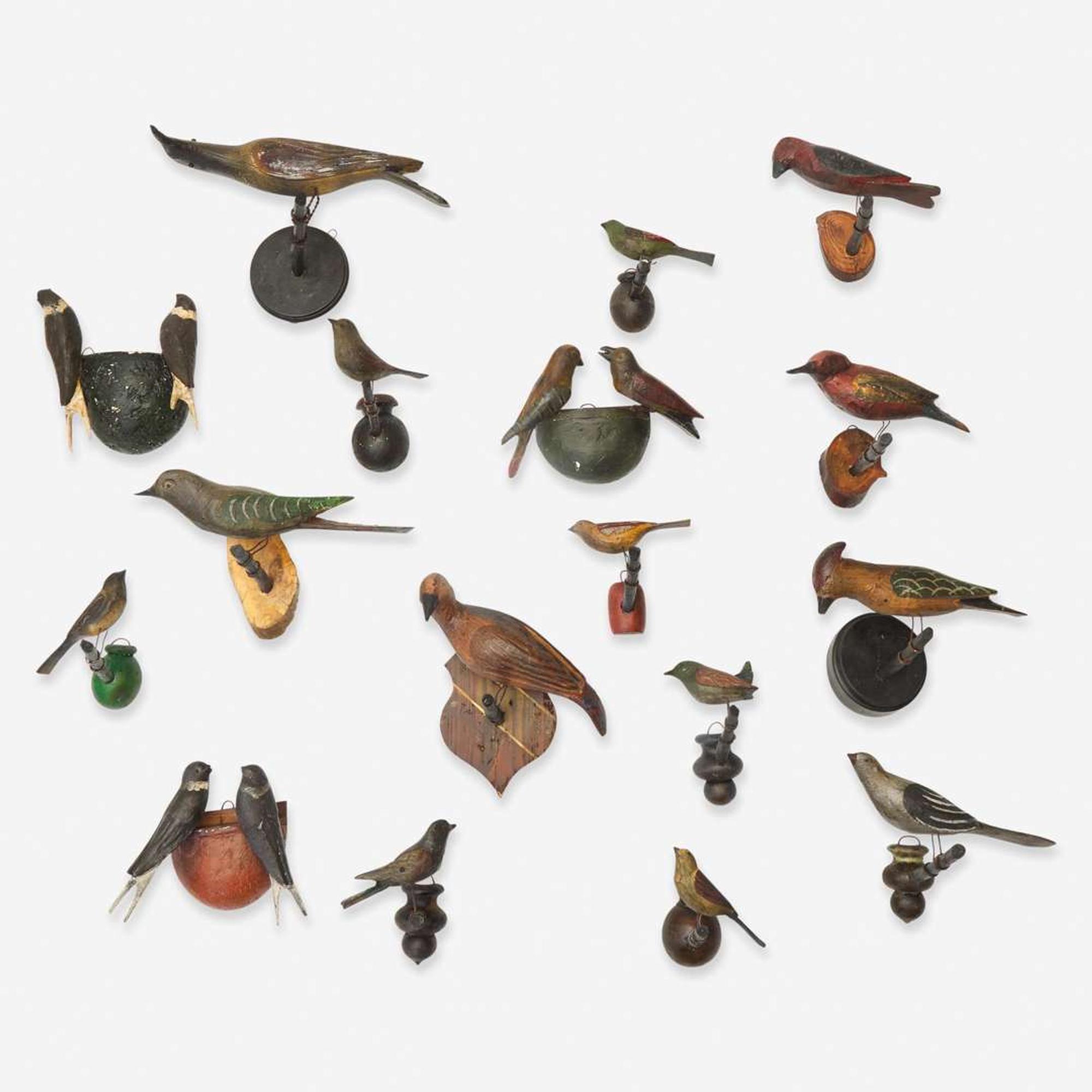 A group of seventeen carved and painted wood birds or bird groups