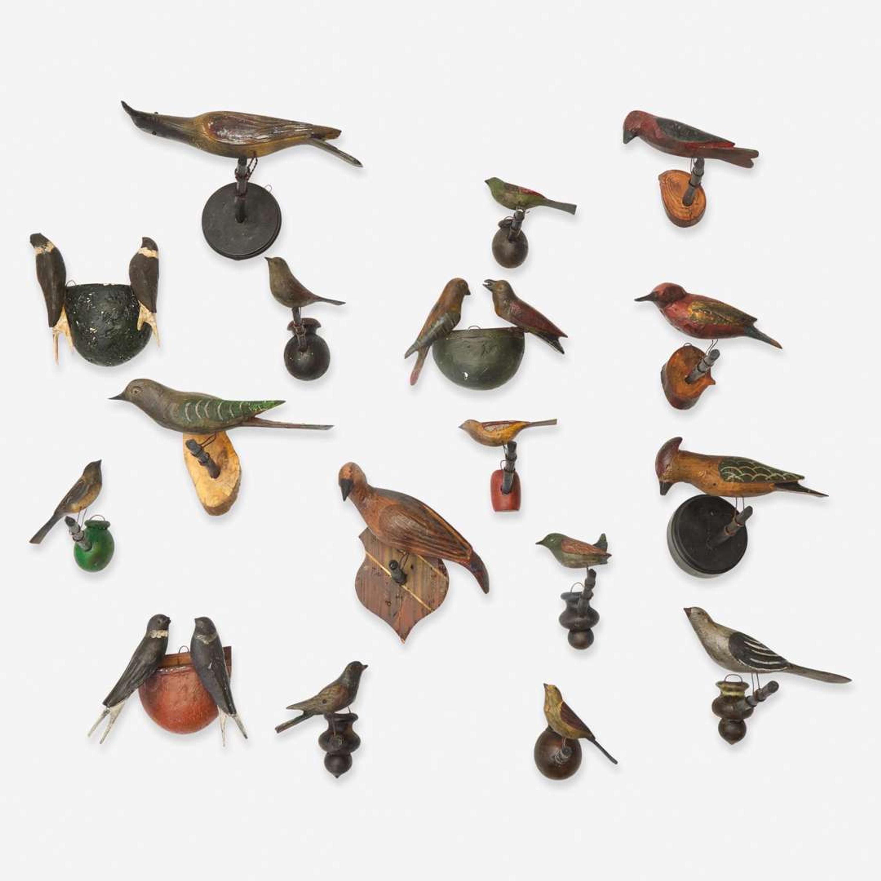 A group of seventeen carved and painted wood birds or bird groups