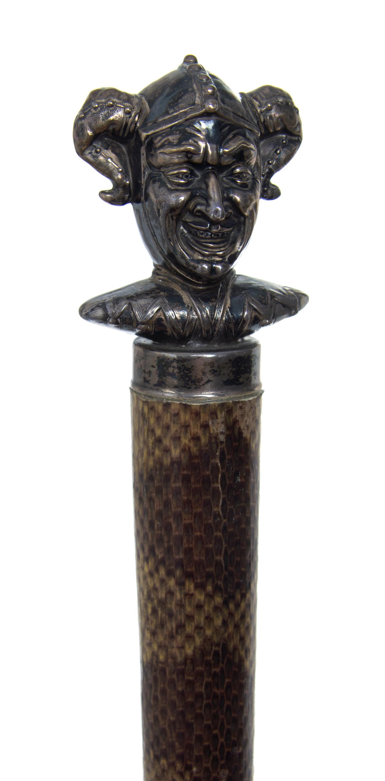 An American Sterling Silver Handled Walking Stick, Unger Brothers, Length of handle 2 1/2 x length overall 32 1/2 inches.