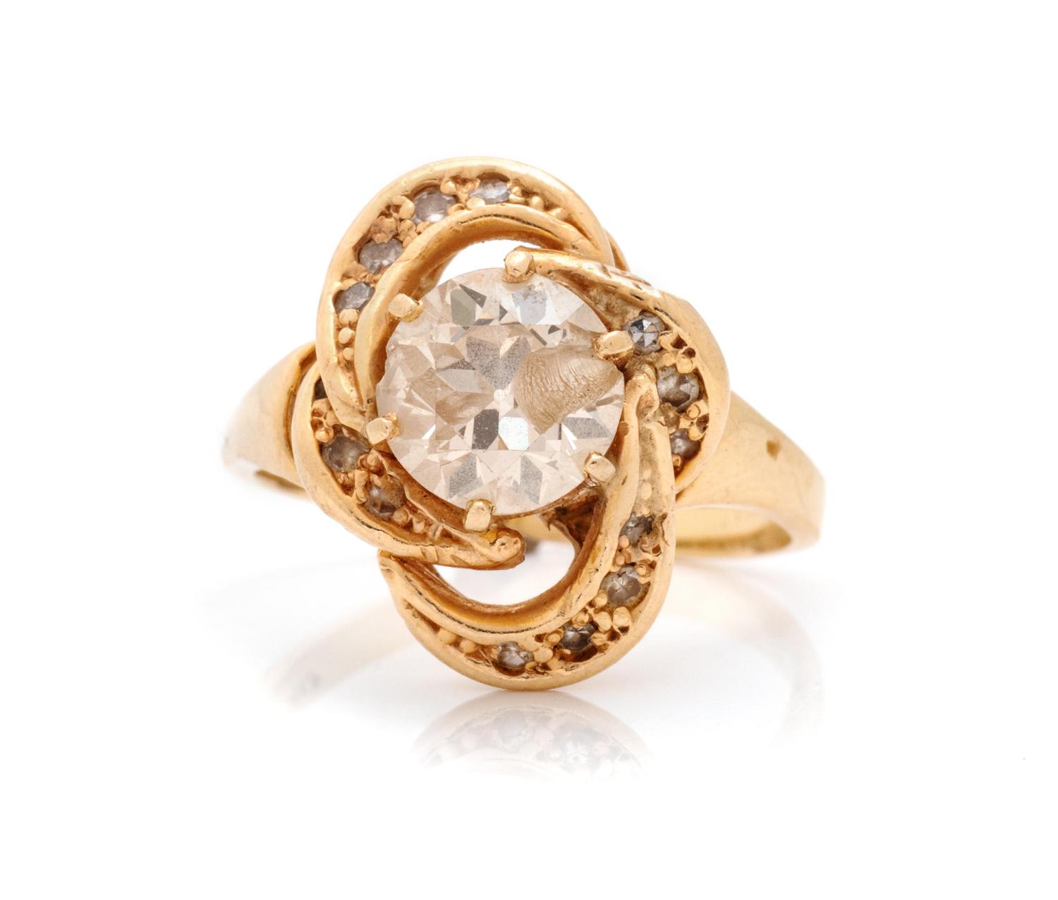 A 14 Karat Yellow Gold and Diamond Ring,