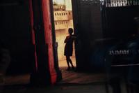 A pair of photographs ( Isabella's Two chairs, 1999; and Woman in Doorway, 1999 )