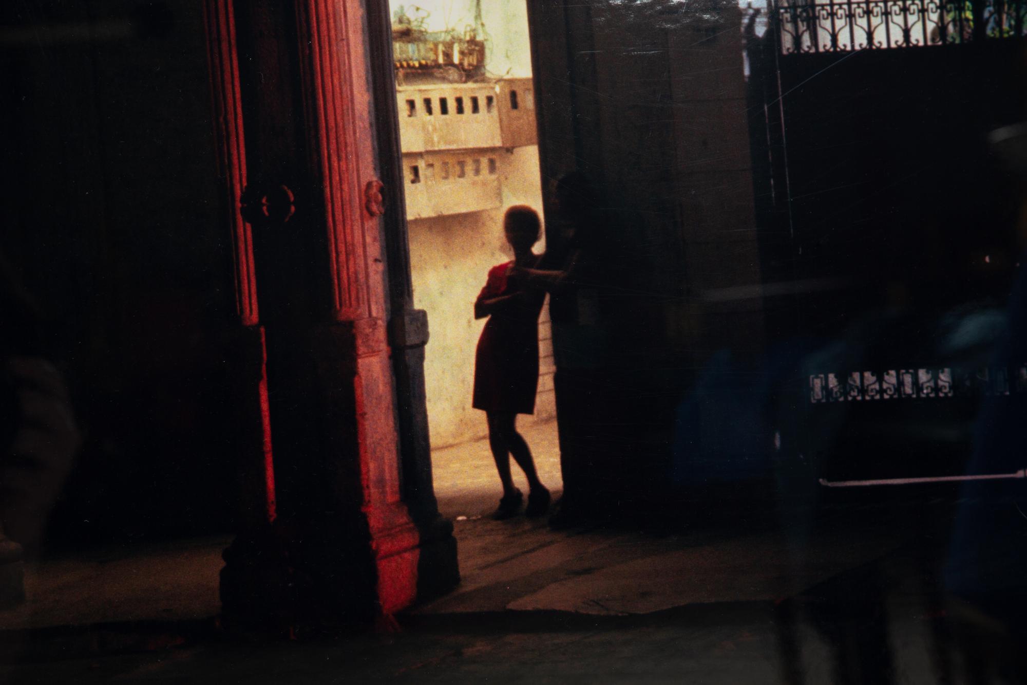 A pair of photographs ( Isabella's Two chairs, 1999; and Woman in Doorway, 1999 )