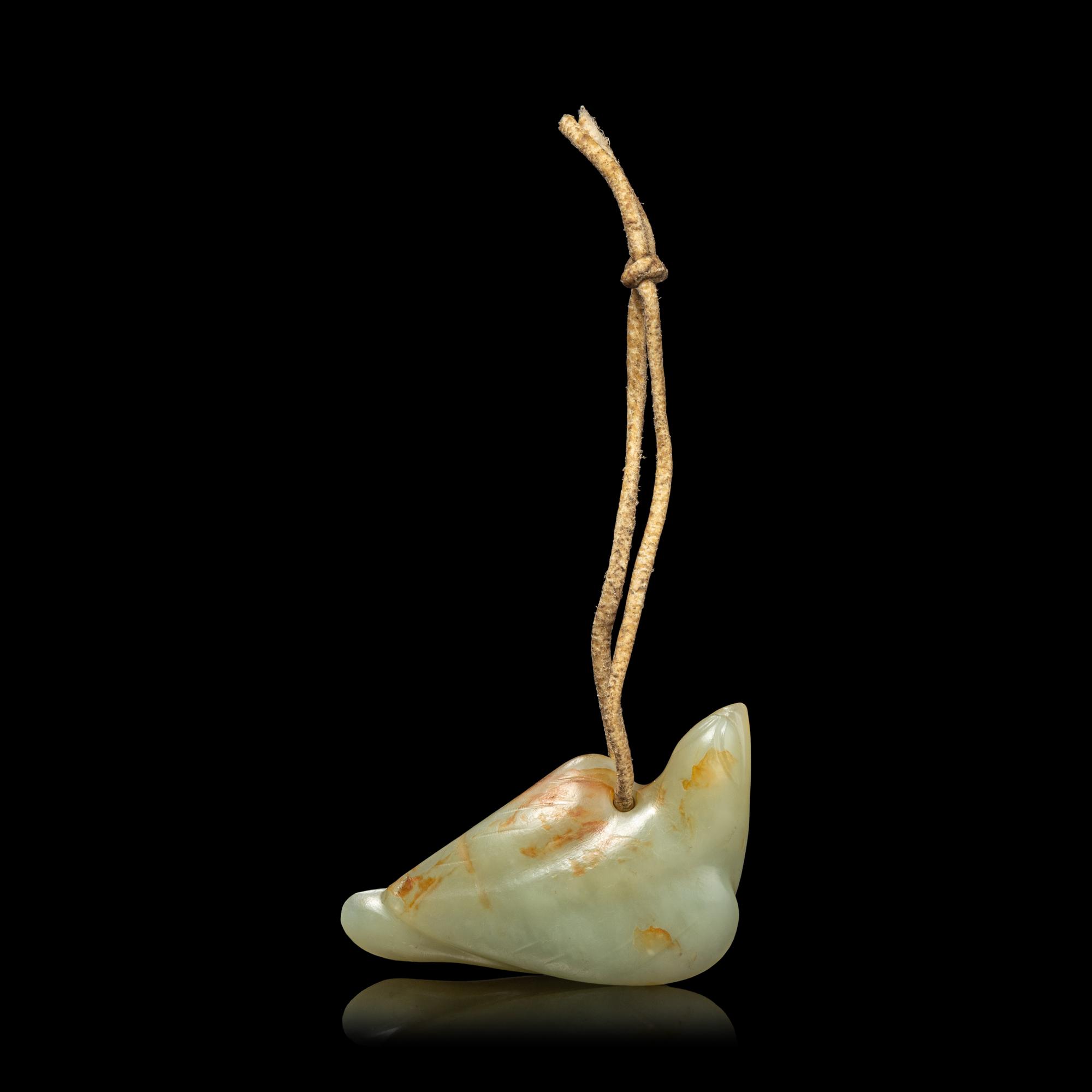A Chinese Russet and Celadon Jade Carving of a Bird, Possibly Ming Dynasty 明 青白玉鳥