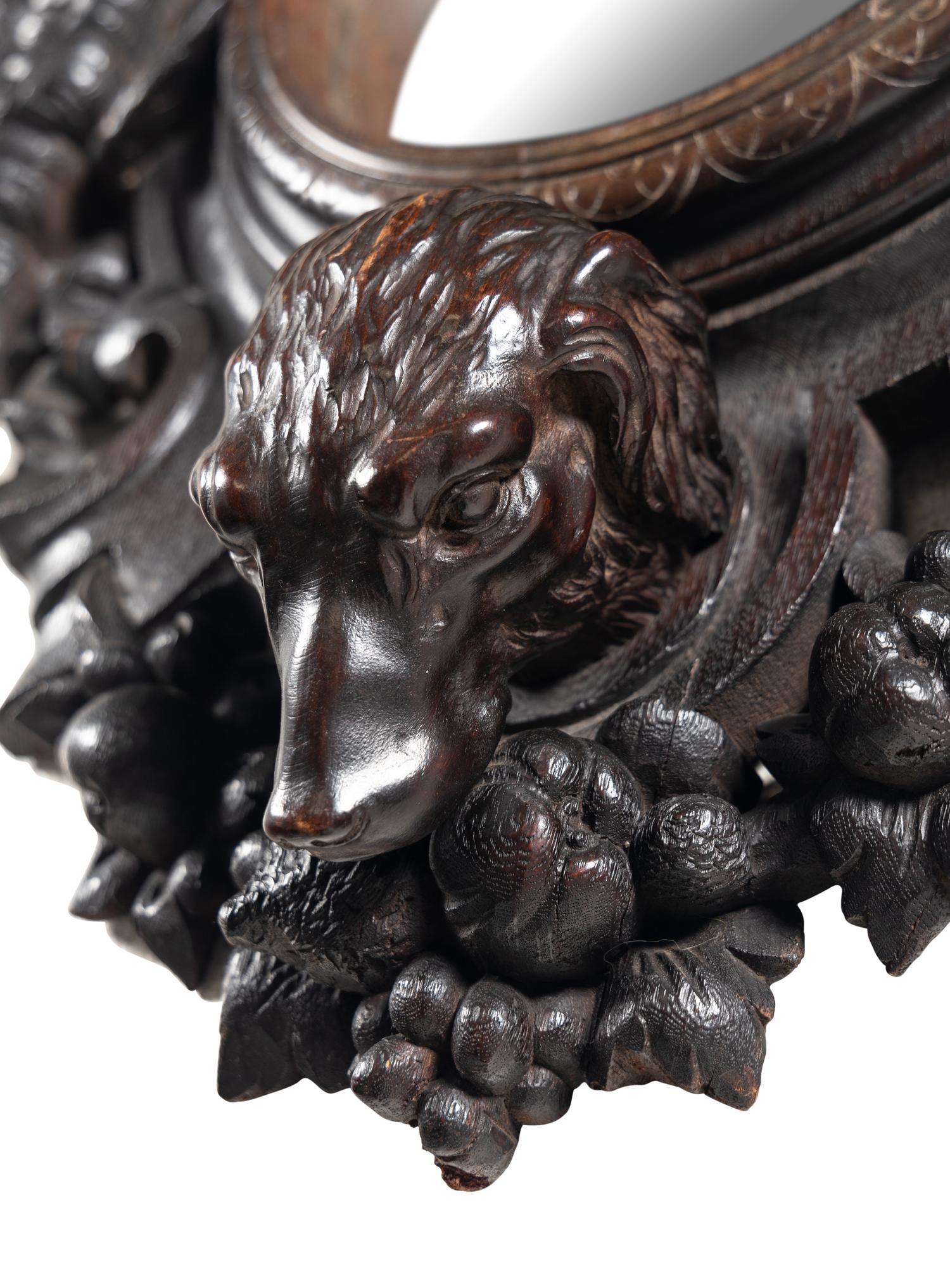 A Black Forest Carved Oak Game Trophy Mirror