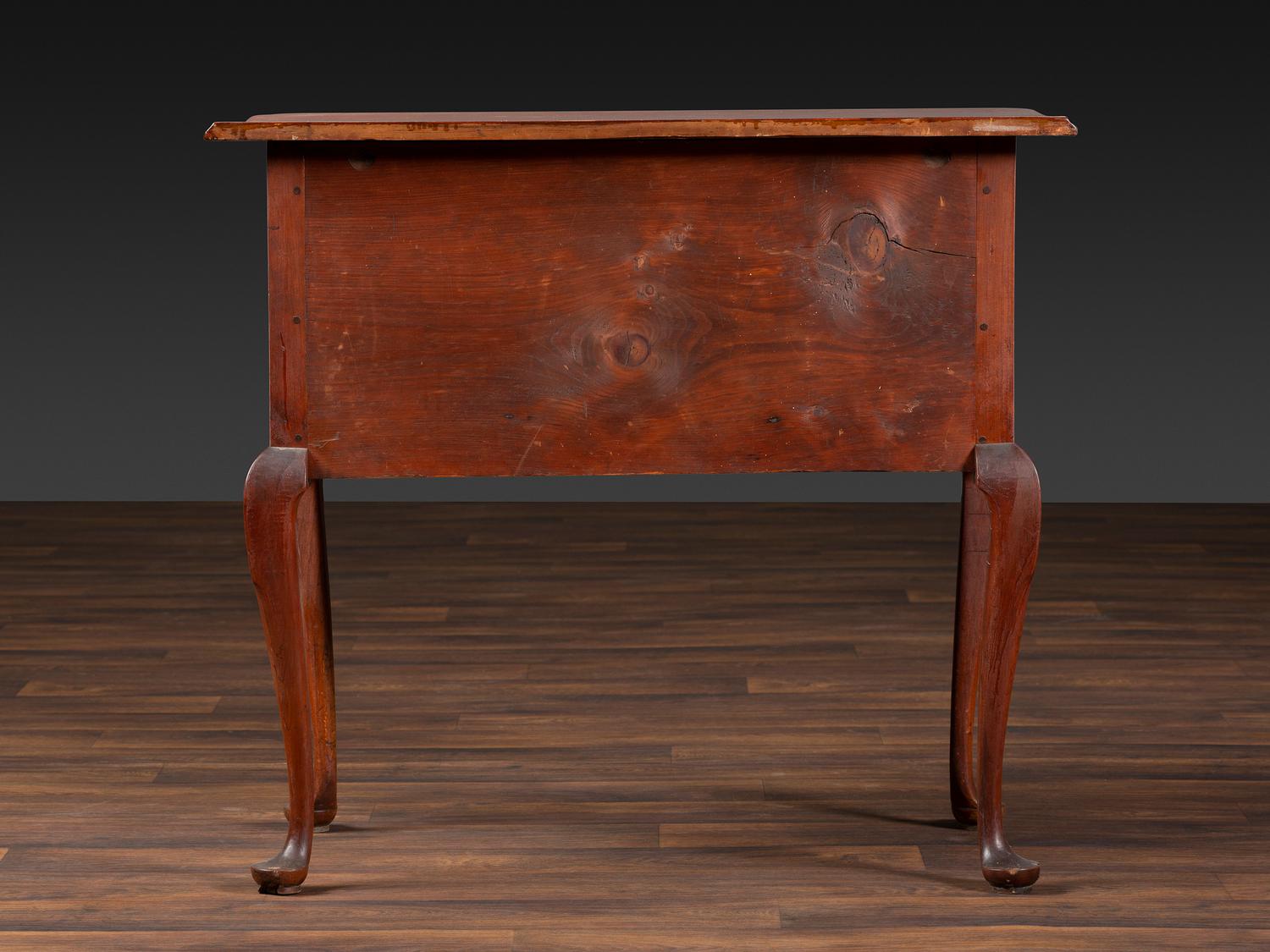 A Queen Anne Cherrywood and Maple Pad Foot Dressing Table