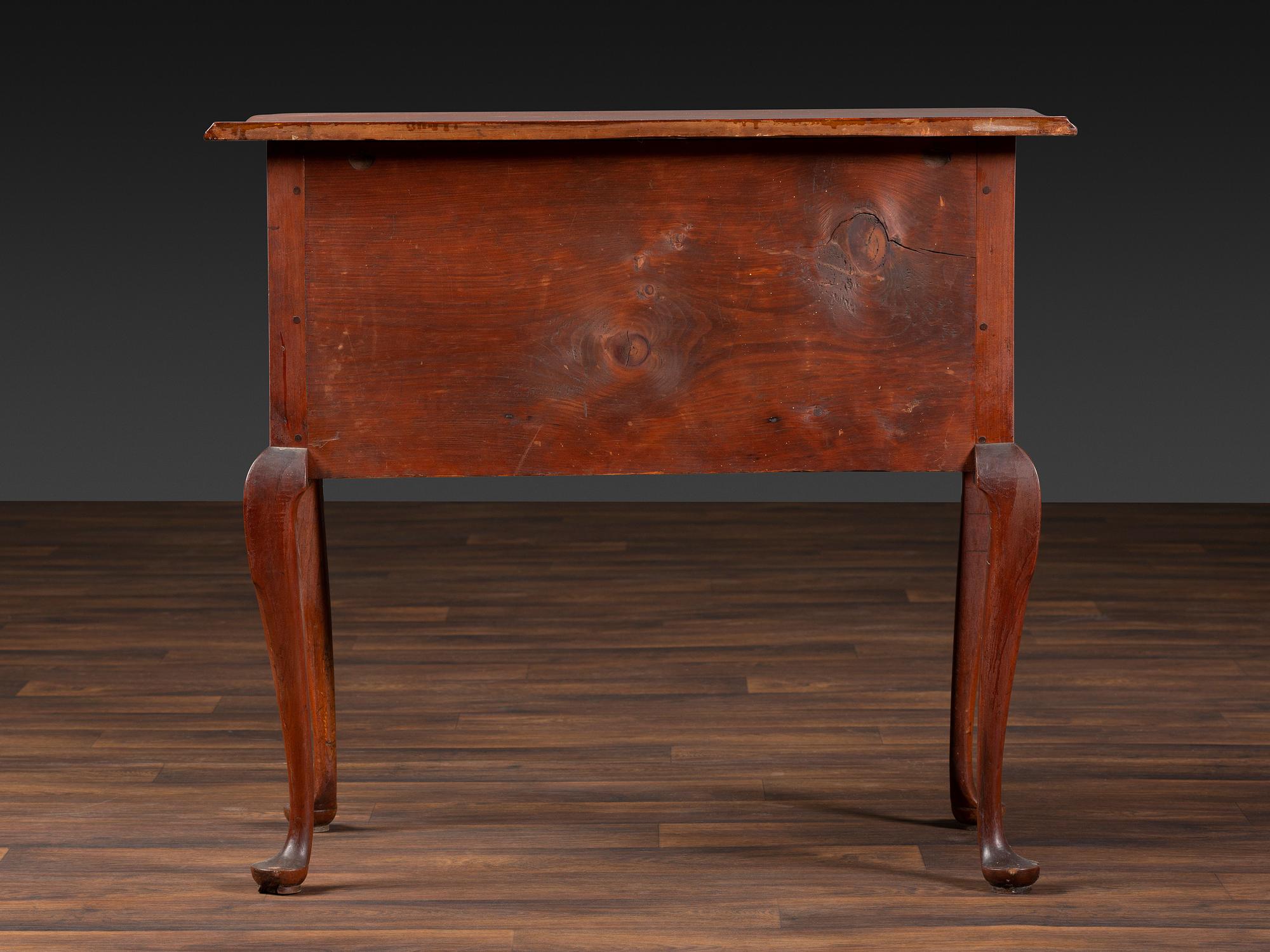 A Queen Anne Cherrywood and Maple Pad Foot Dressing Table