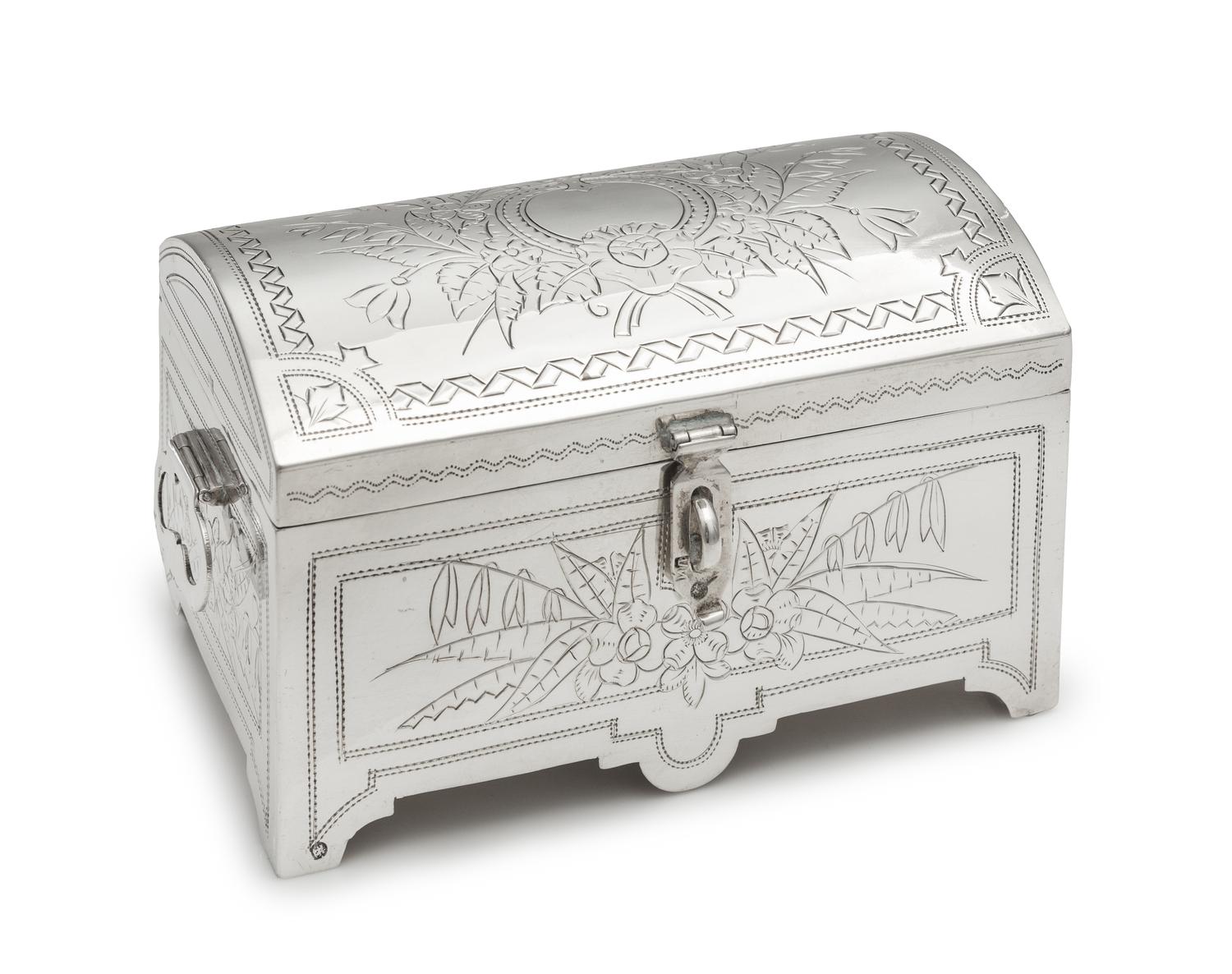 A Russian Silver Table Casket, Mark of Iuka Lozinski, Assay of Lev Oleks, Moscow, 1892, the lid and body worked to show floral and foli