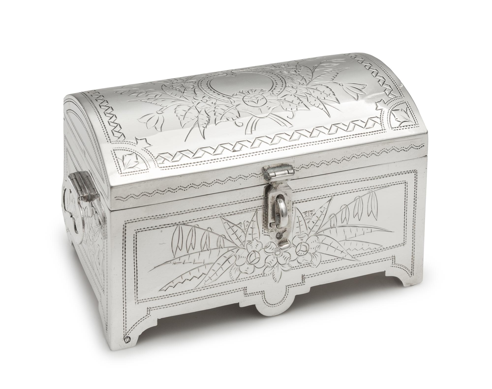 A Russian Silver Table Casket, Mark of Iuka Lozinski, Assay of Lev Oleks, Moscow, 1892, the lid and body worked to show floral and foli