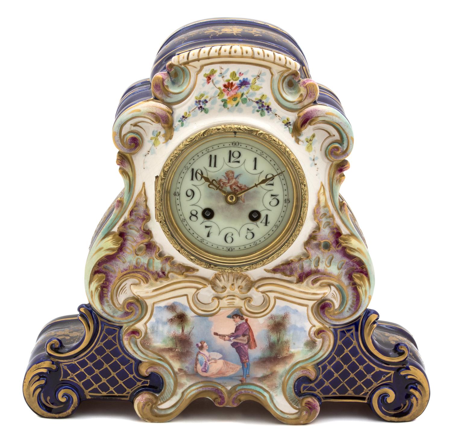 A Continental Polychrome and Gilt Decorated Pottery Clock Height 12 1/2 inches. — 20TH CENTURY