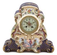 A Continental Polychrome and Gilt Decorated Pottery Clock Height 12 1/2 inches. — 20TH CENTURY