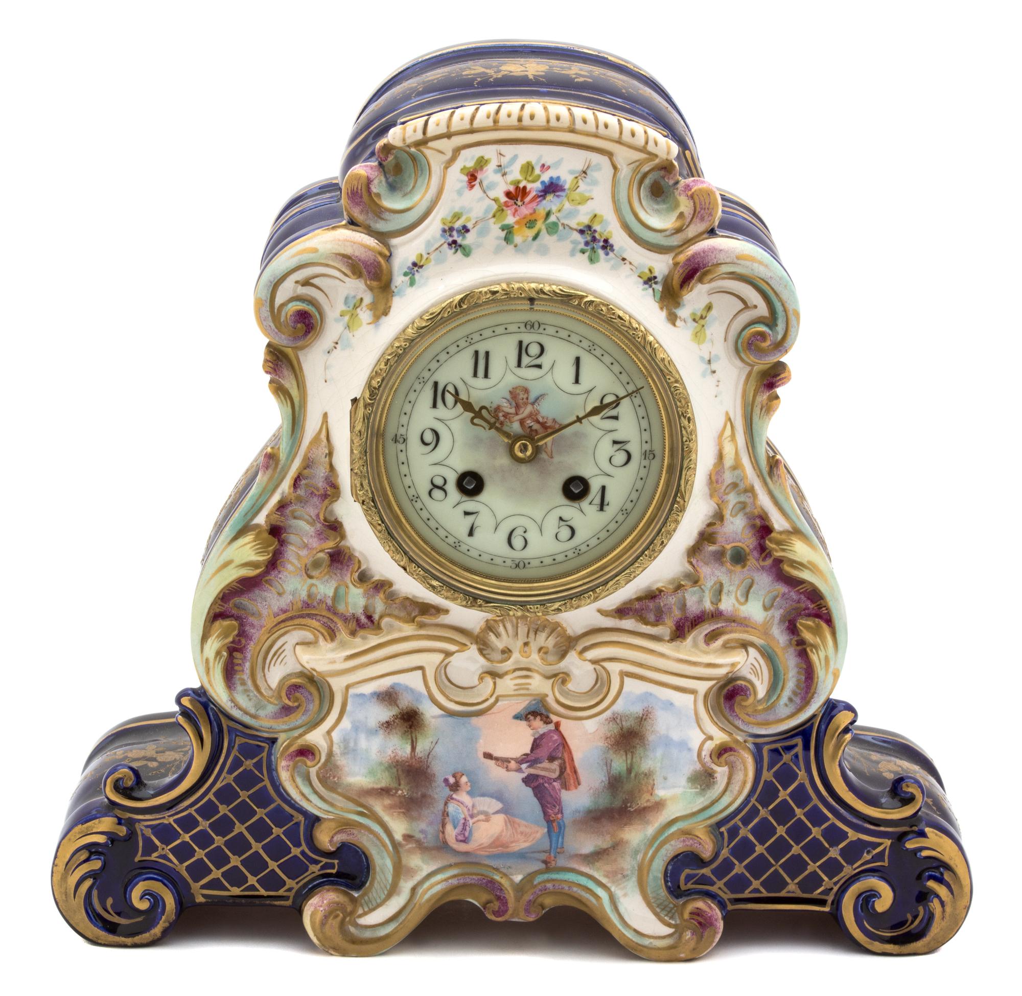 A Continental Polychrome and Gilt Decorated Pottery Clock Height 12 1/2 inches. — 20TH CENTURY