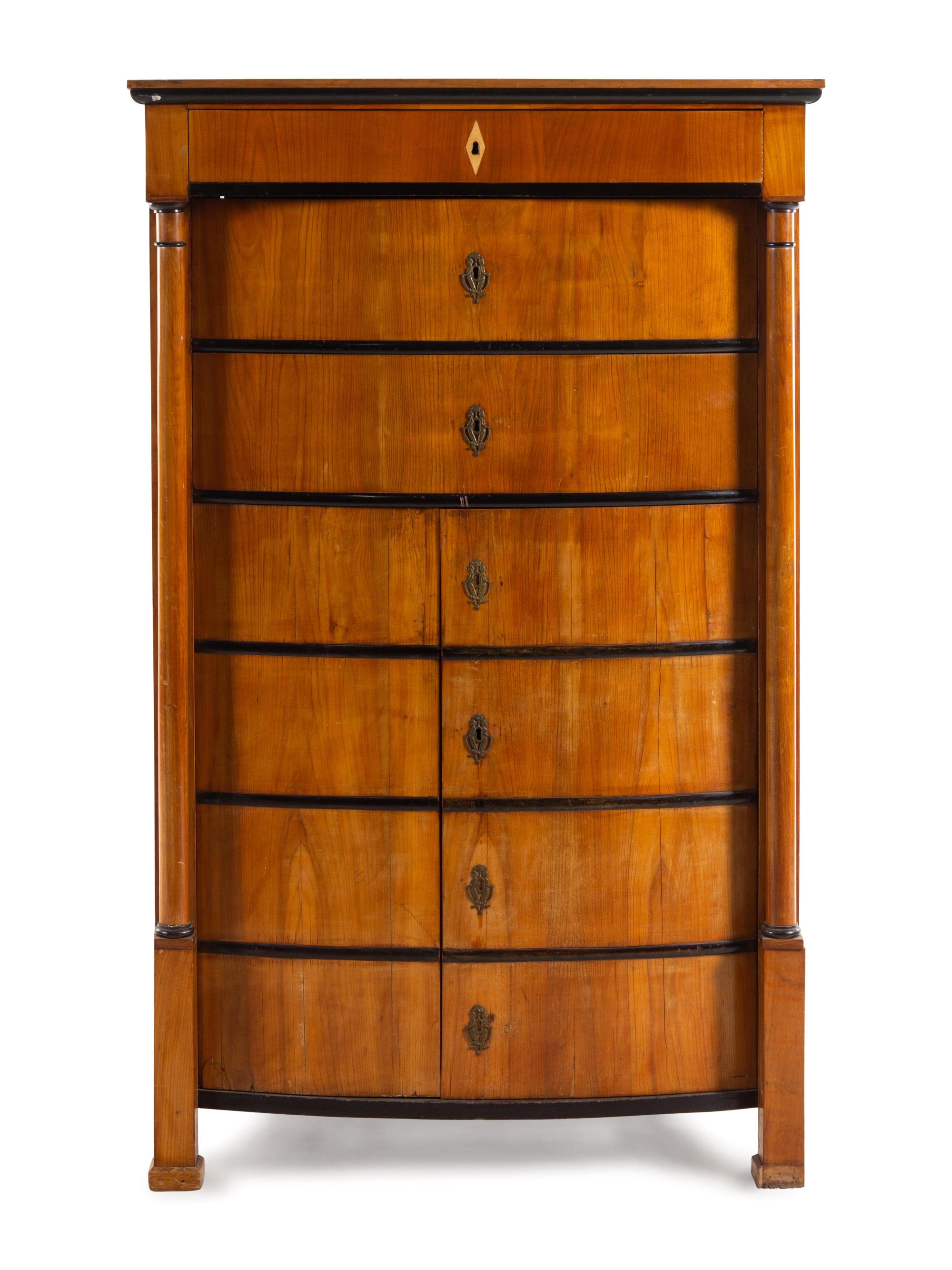 A Biedermeier Parcel Ebonized Walnut Tall Chest of Drawers