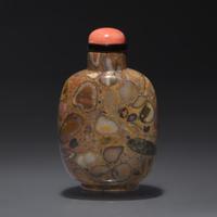 A Chinese Carved Puddingstone Snuff Bottle, Qing Dynasty, Circa 1750-1850 — 1750-1850年 抱子石素面鼻煙壺