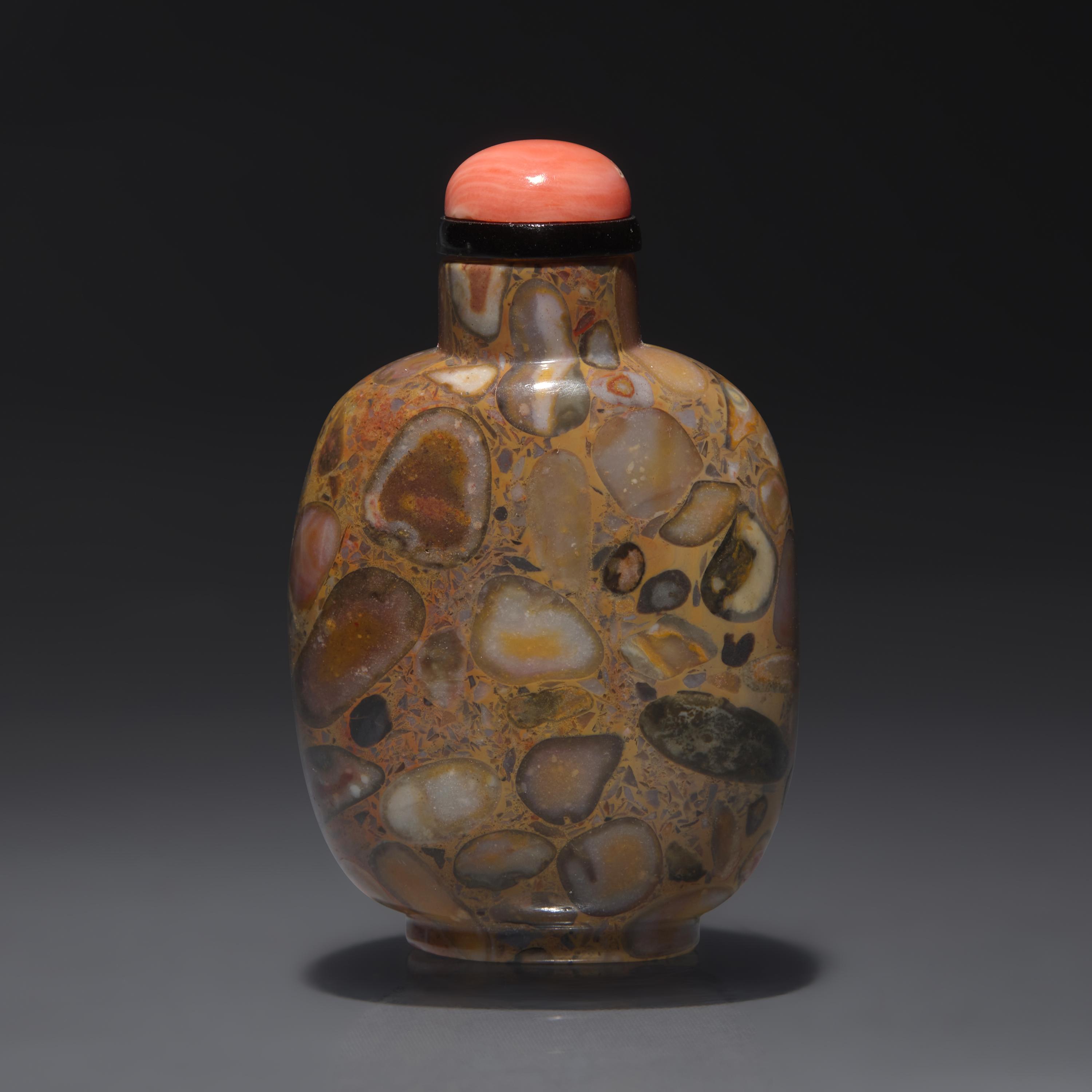 A Chinese Carved Puddingstone Snuff Bottle, Qing Dynasty, Circa 1750-1850 — 1750-1850年 抱子石素面鼻煙壺