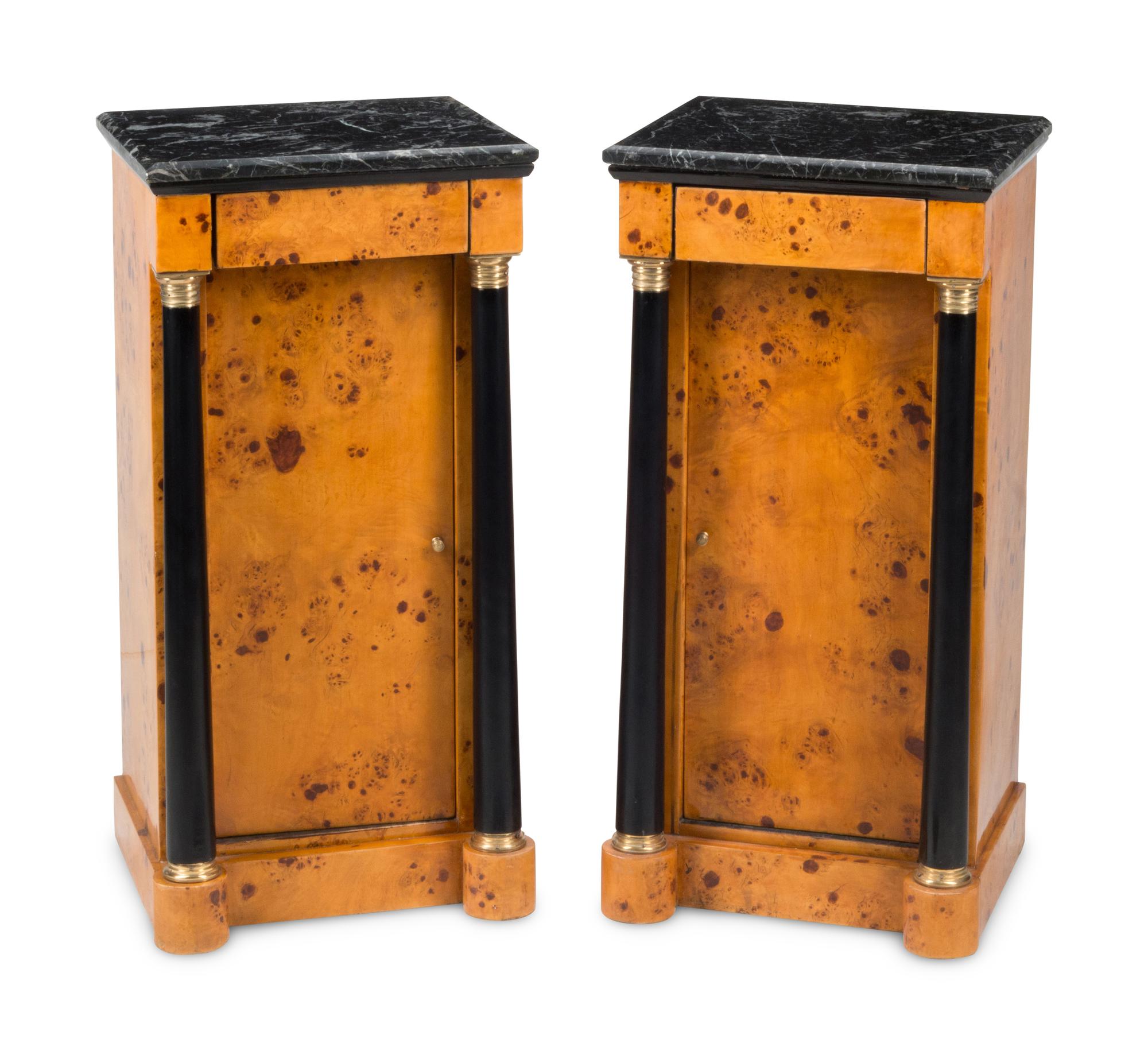 A Pair of Empire Style Part-Ebonized Marble-Top Bedside Tables