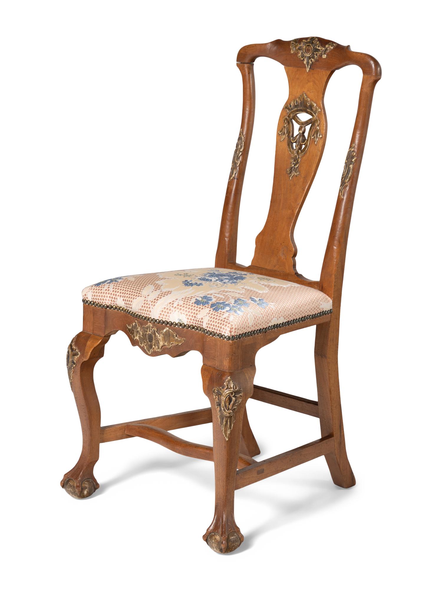 A Set of Four Dutch Parcel-Gilt Walnut Side Chairs