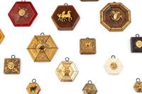 A Collection of Framed Metal Animal Figures