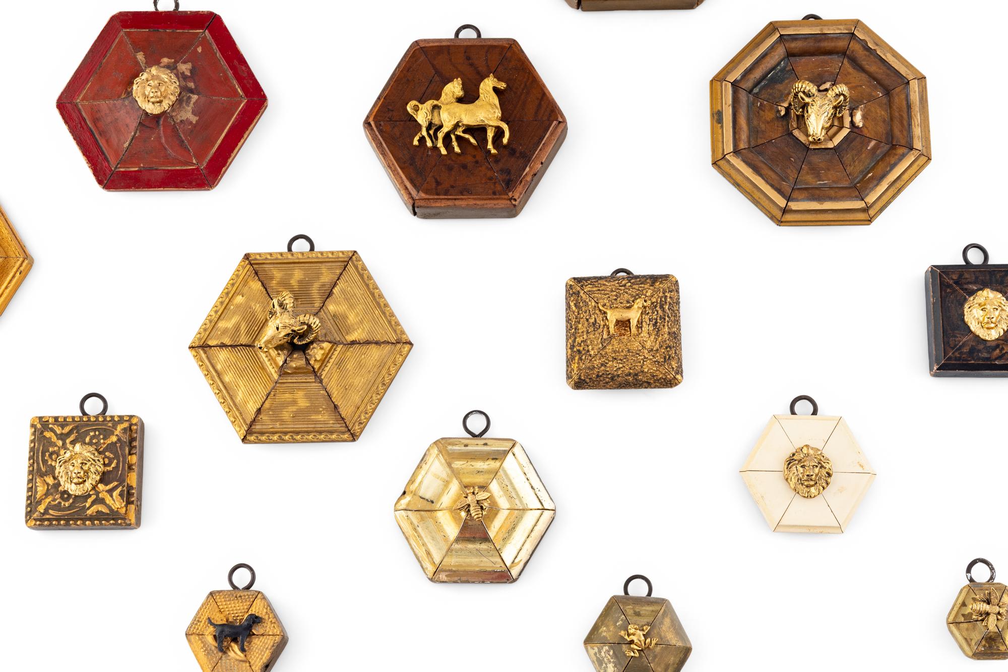 A Collection of Framed Metal Animal Figures