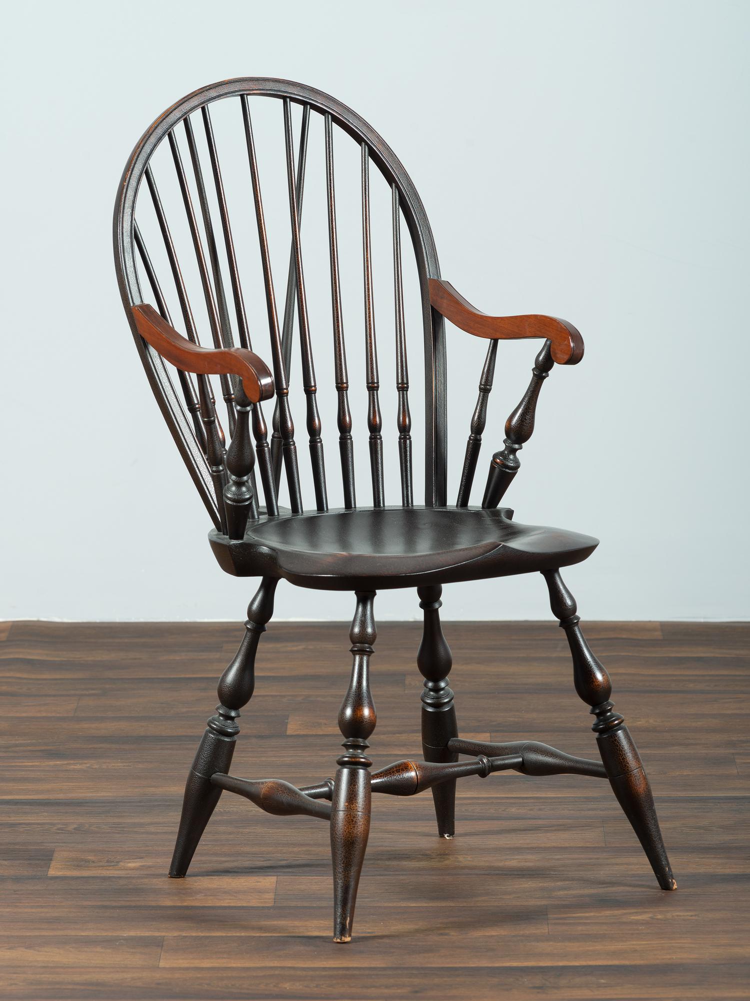 A D.R. Dimes Black-Painted Brace-Back Compass-Seat Windsor Armchair