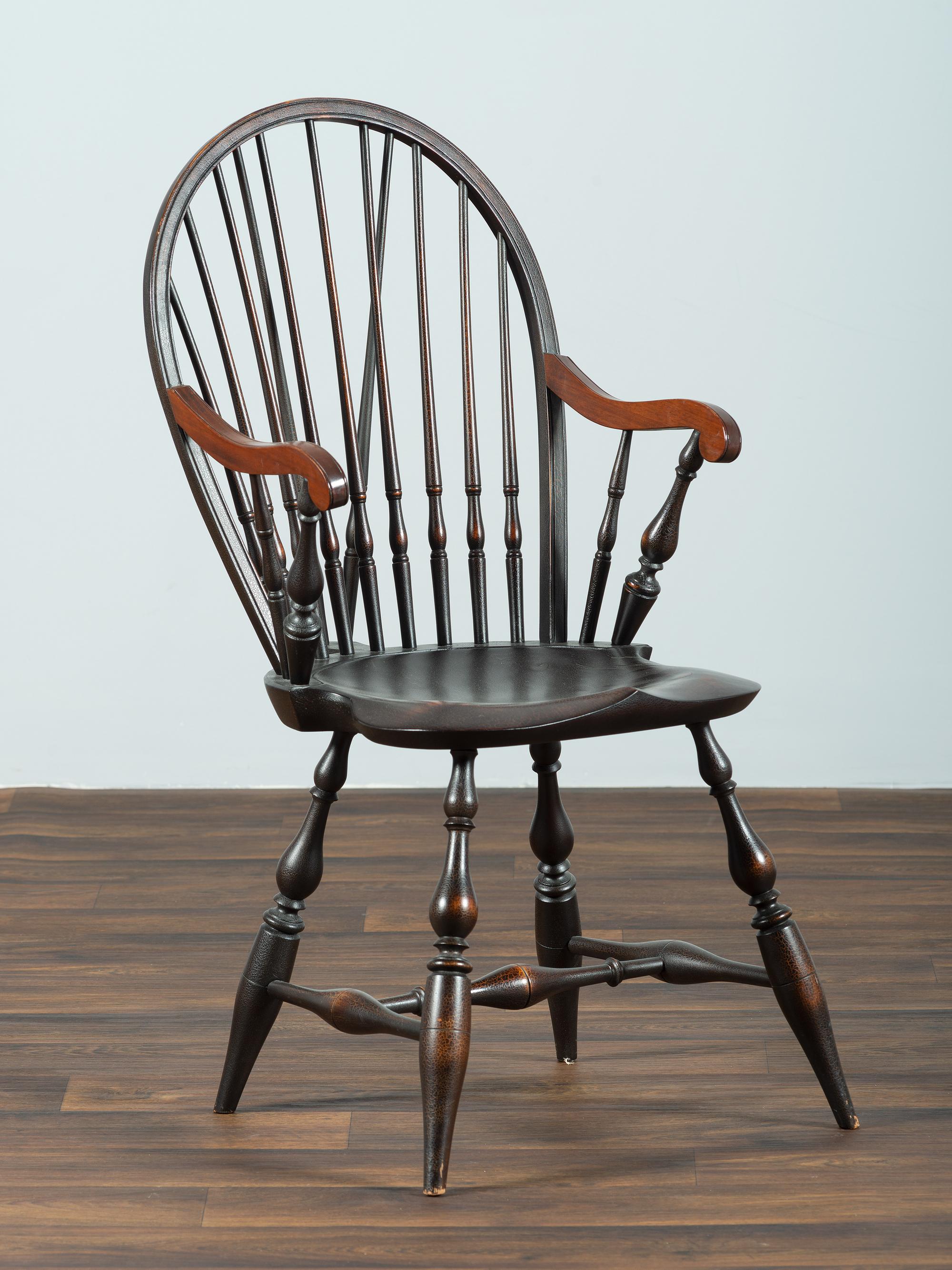 A D.R. Dimes Black-Painted Brace-Back Compass-Seat Windsor Armchair
