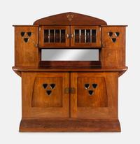 An Austrian Secessionist Inlaid Dining Suite, comprising a sideboard, a server, an extension dining table with five leaves, six side chairs and four armchairs