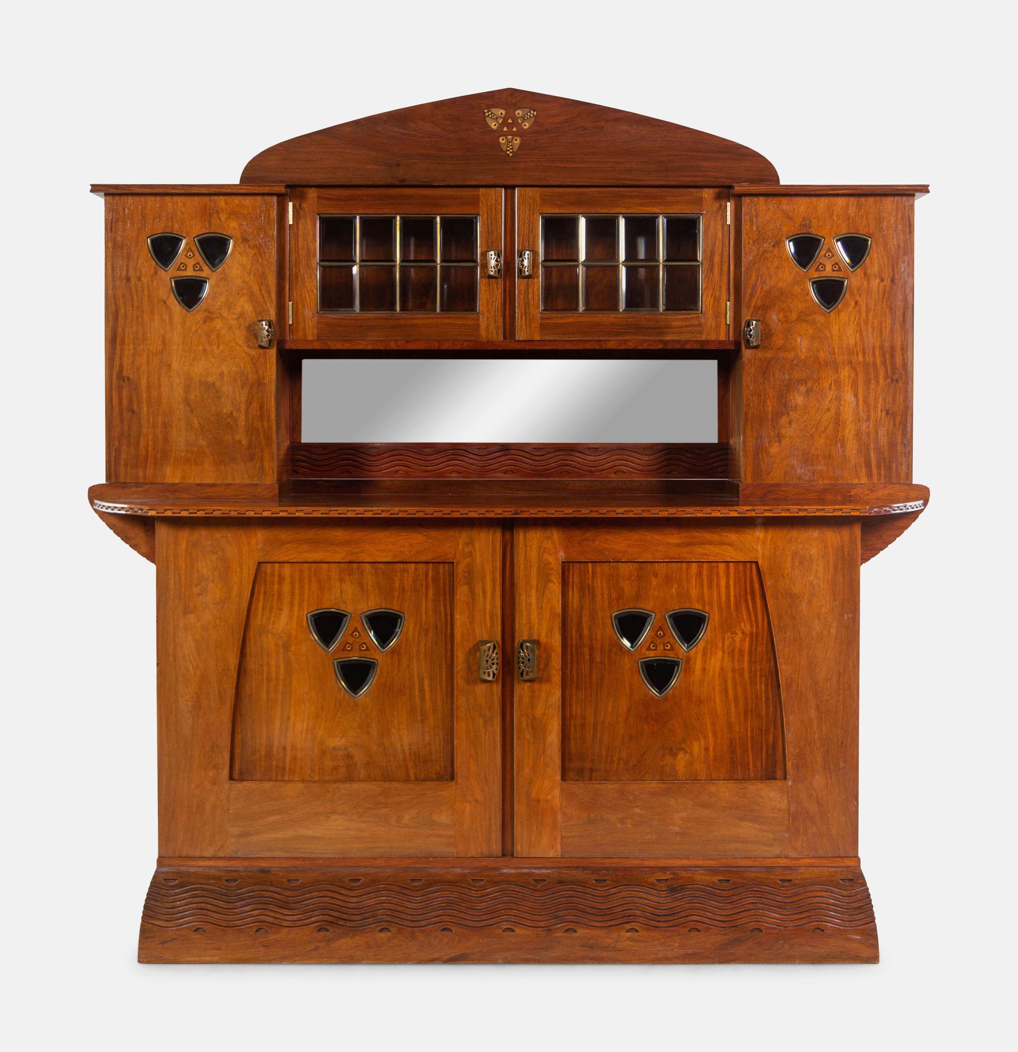 An Austrian Secessionist Inlaid Dining Suite, comprising a sideboard, a server, an extension dining table with five leaves, six side chairs and four armchairs