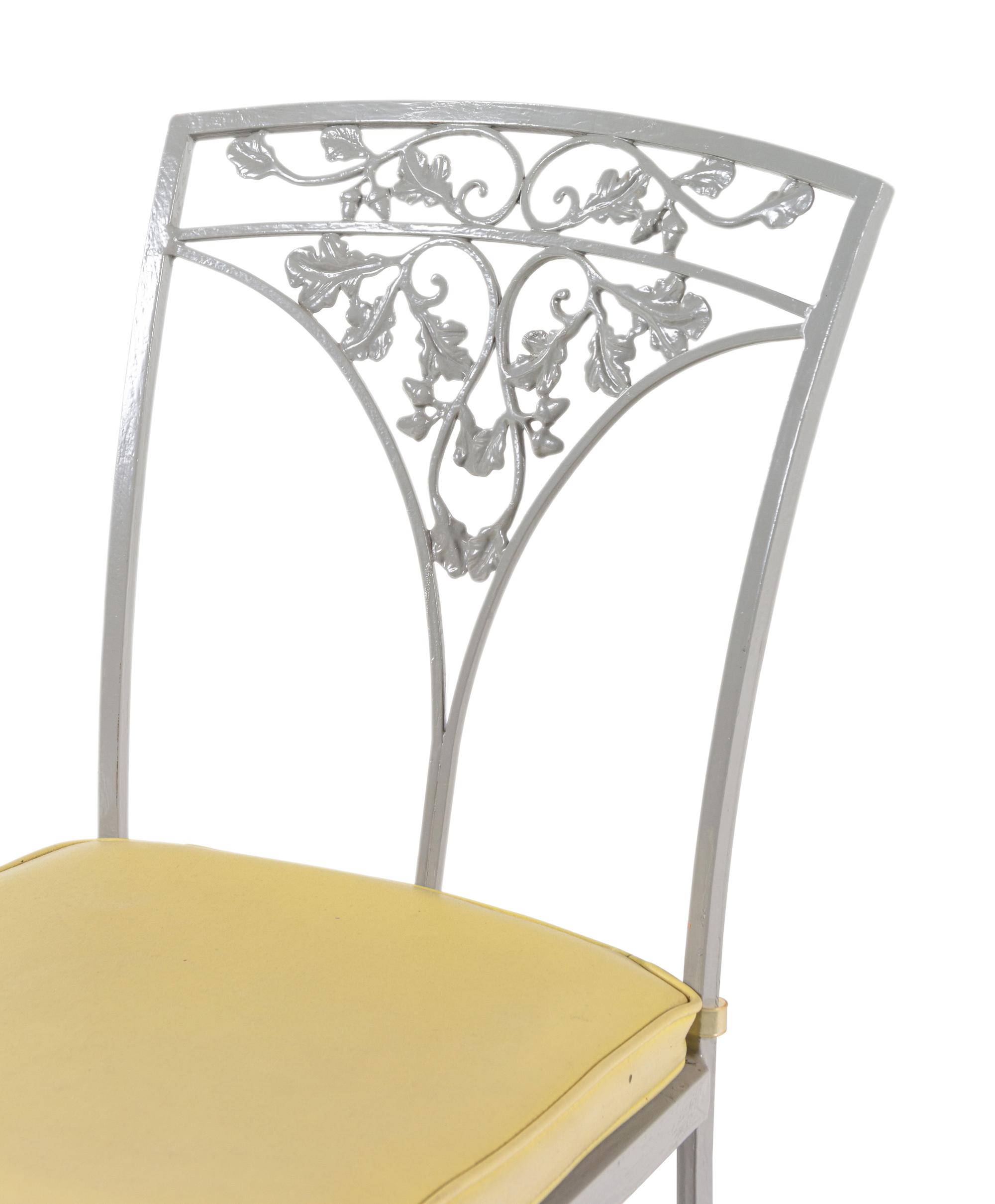 A Woodard "Orleans" Style Painted Iron Garden Table and Four Chairs