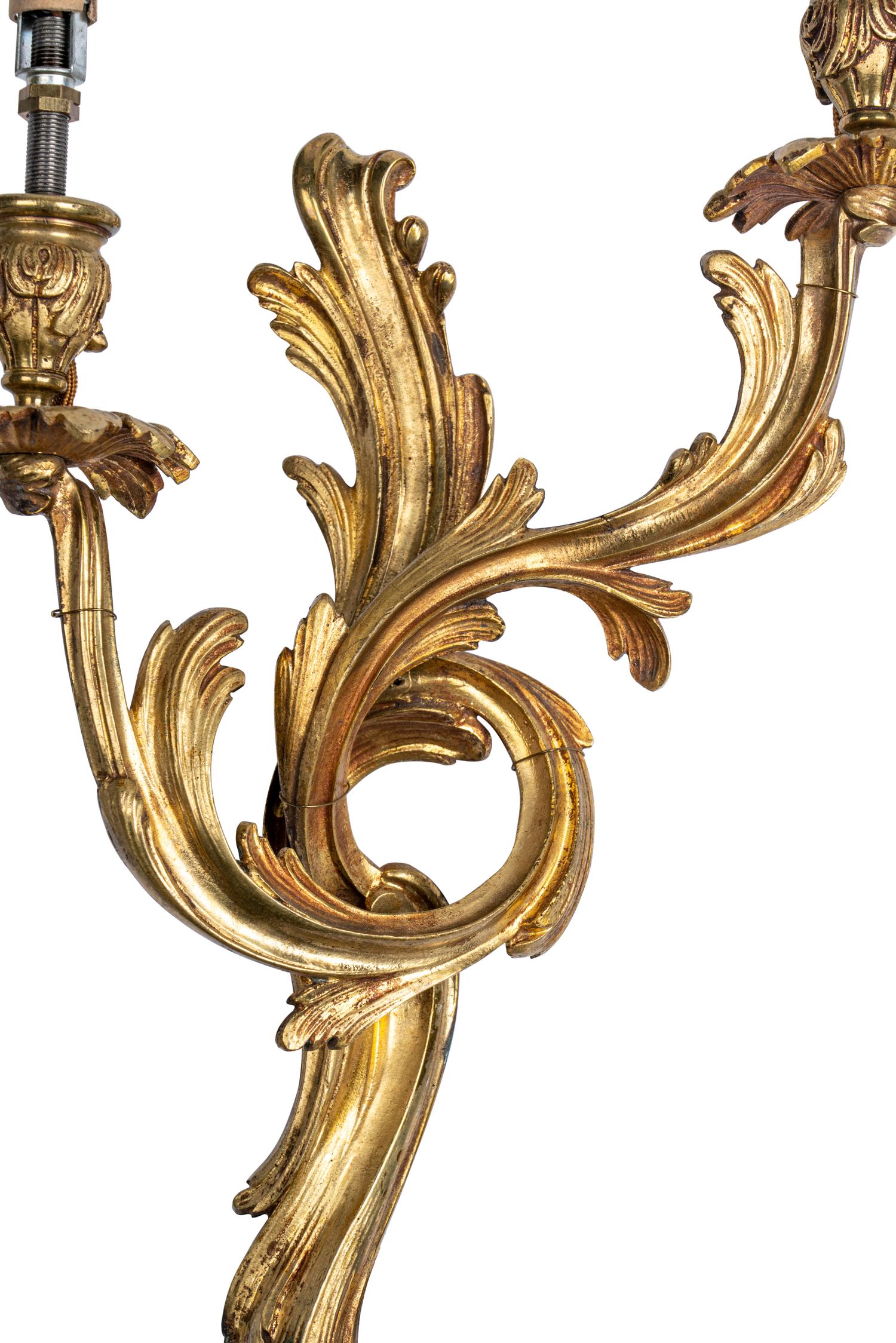 A Pair of Louis XV Style Gilt Bronze Two-Light Sconces