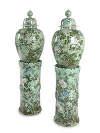 A Pair of Chinese Large Porcelain Covered Urns on Pedestals