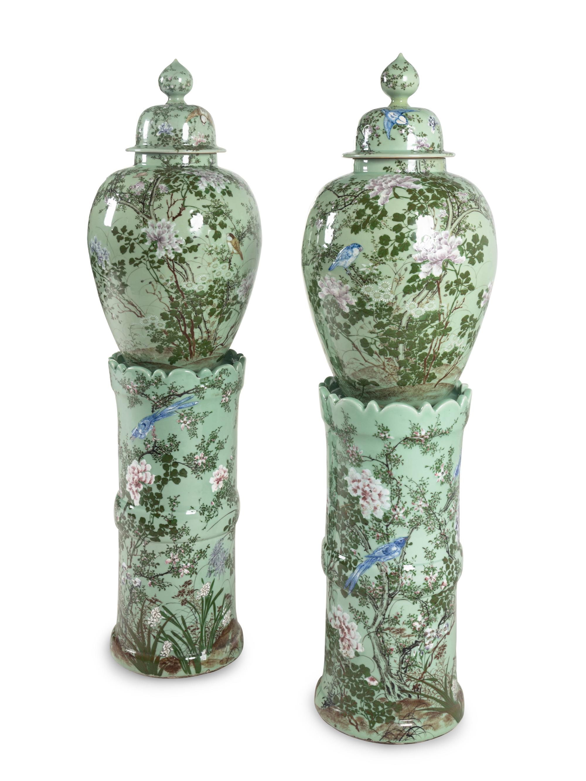 A Pair of Chinese Large Porcelain Covered Urns on Pedestals
