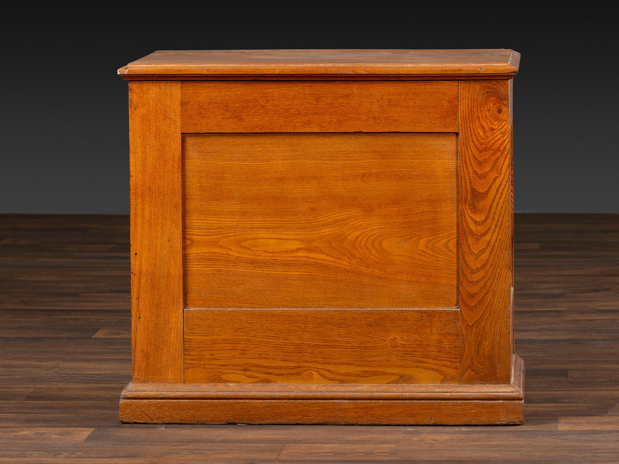 A Six-Drawer Oak Spool Cabinet