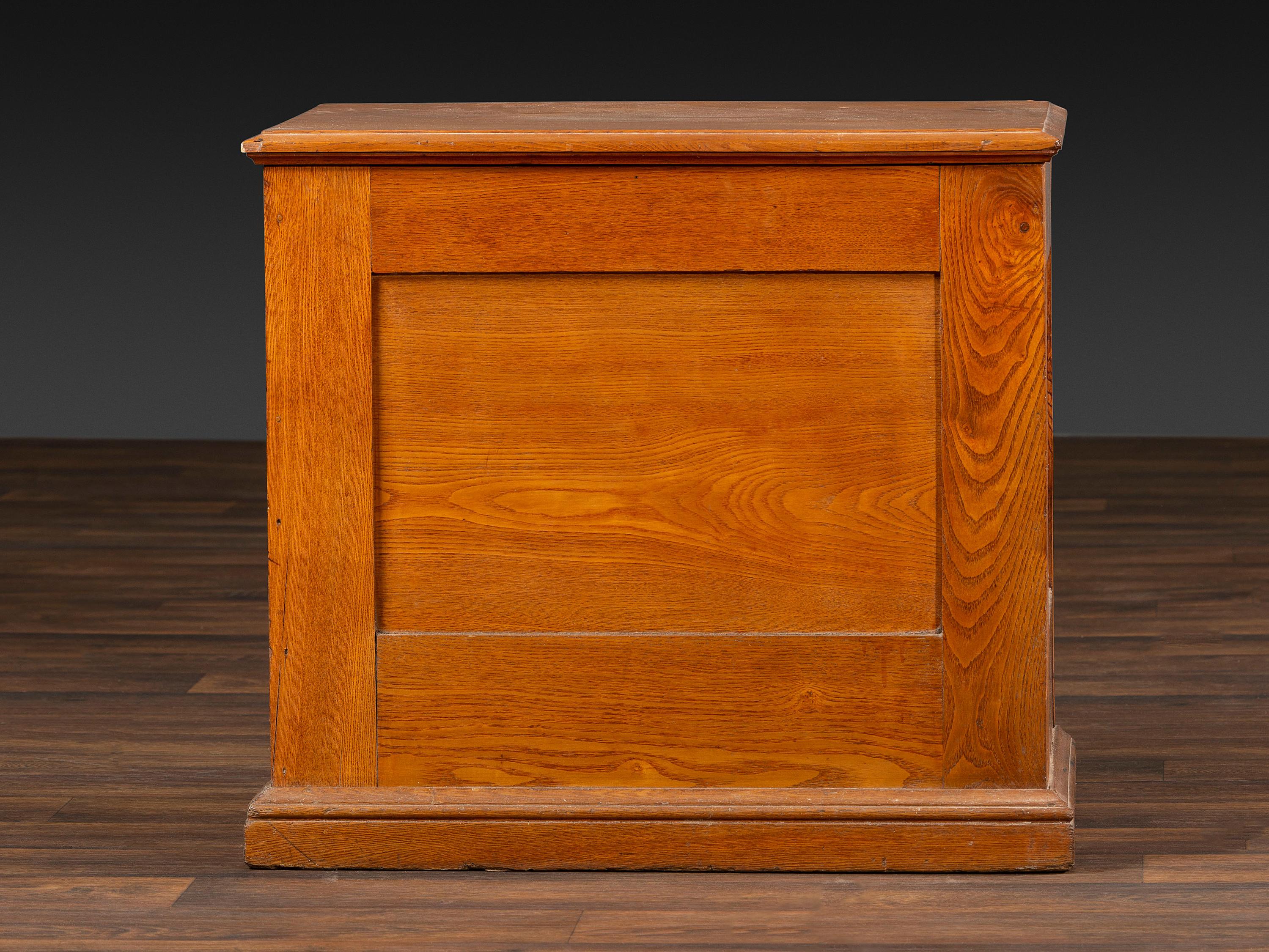A Six-Drawer Oak Spool Cabinet