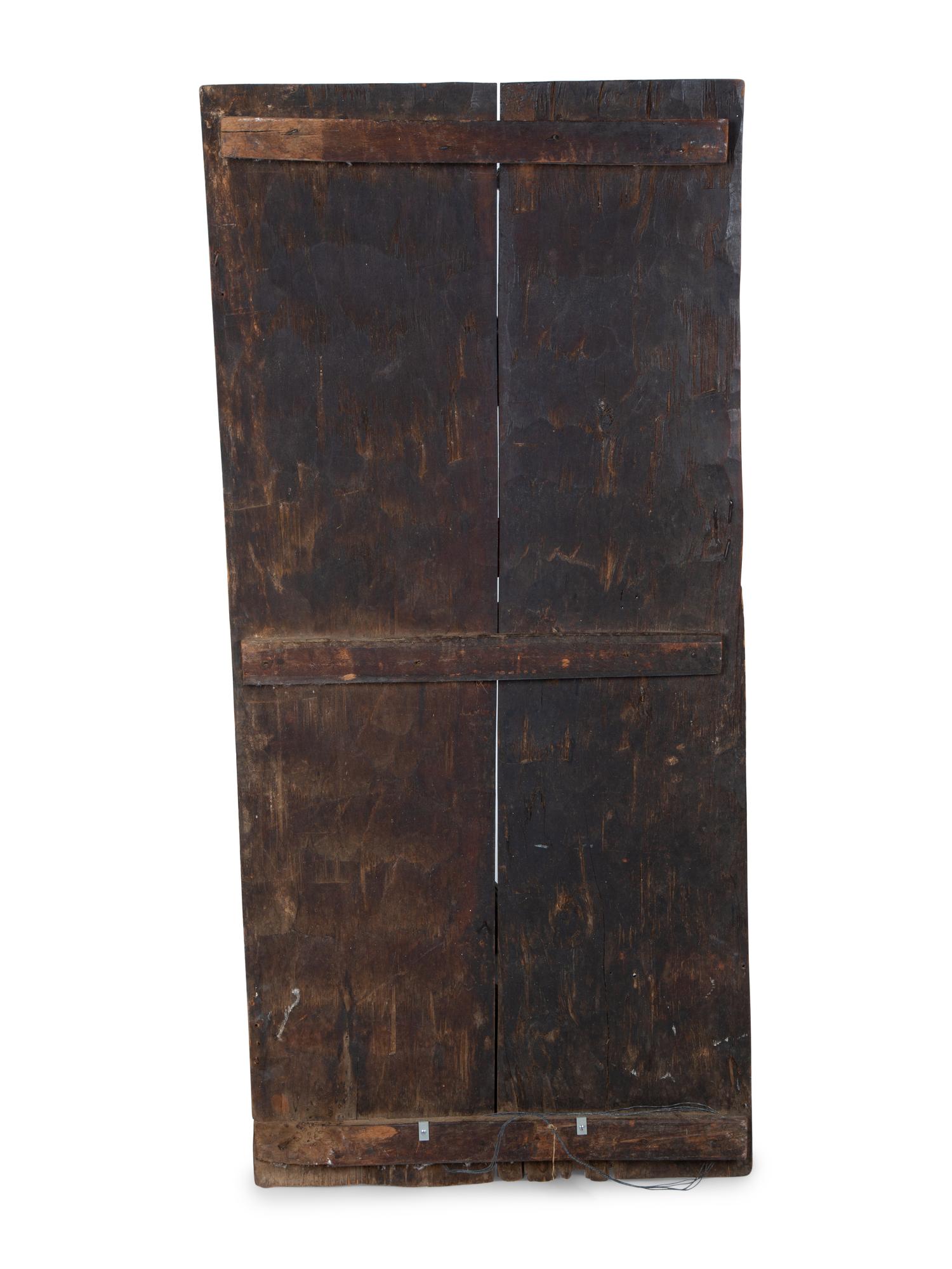 An African Carved Wood Panel — 20TH CENTURY