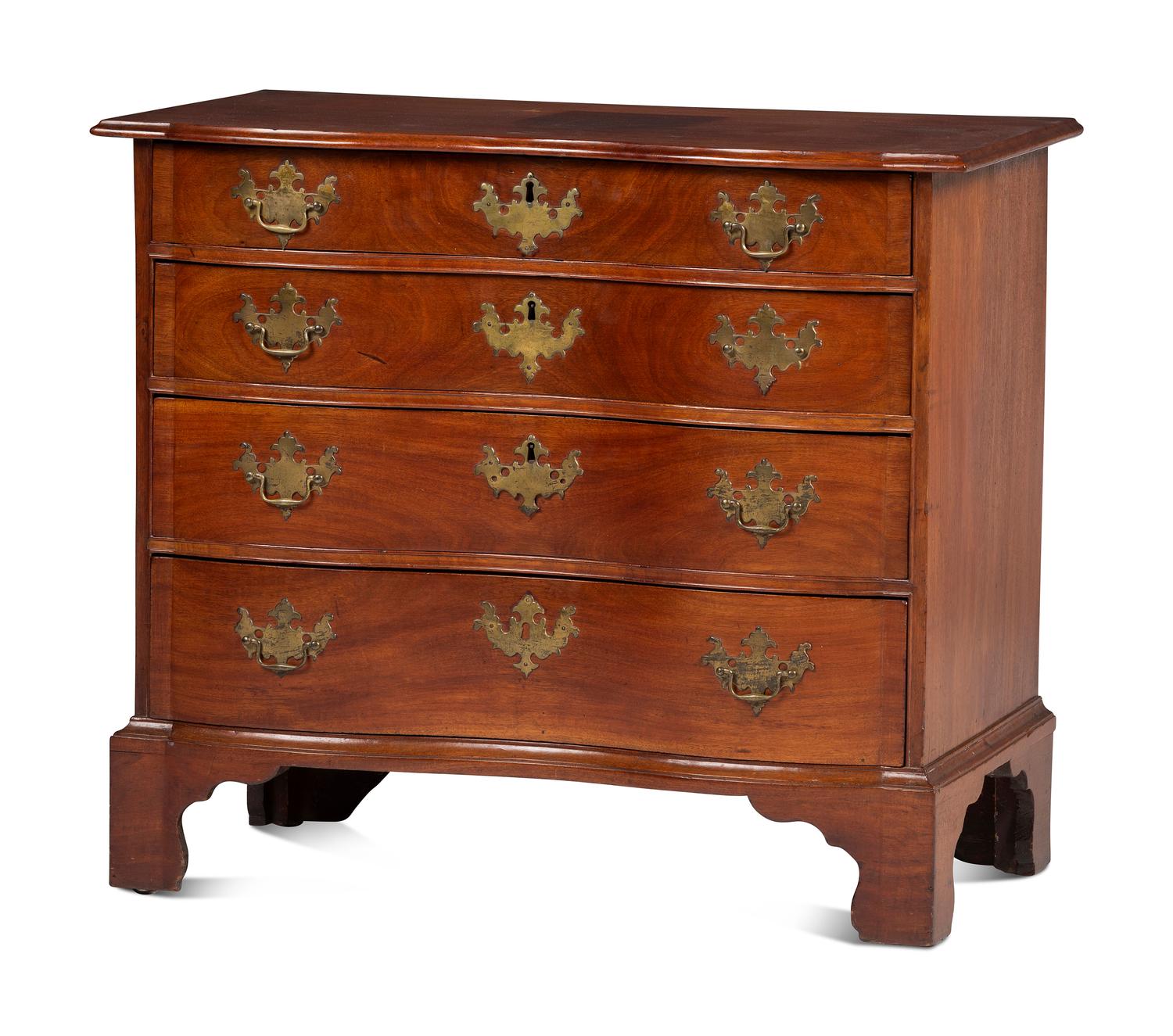 A Chippendale Carved Mahogany Reverse Serpentine Chest of Drawers, 18th Century