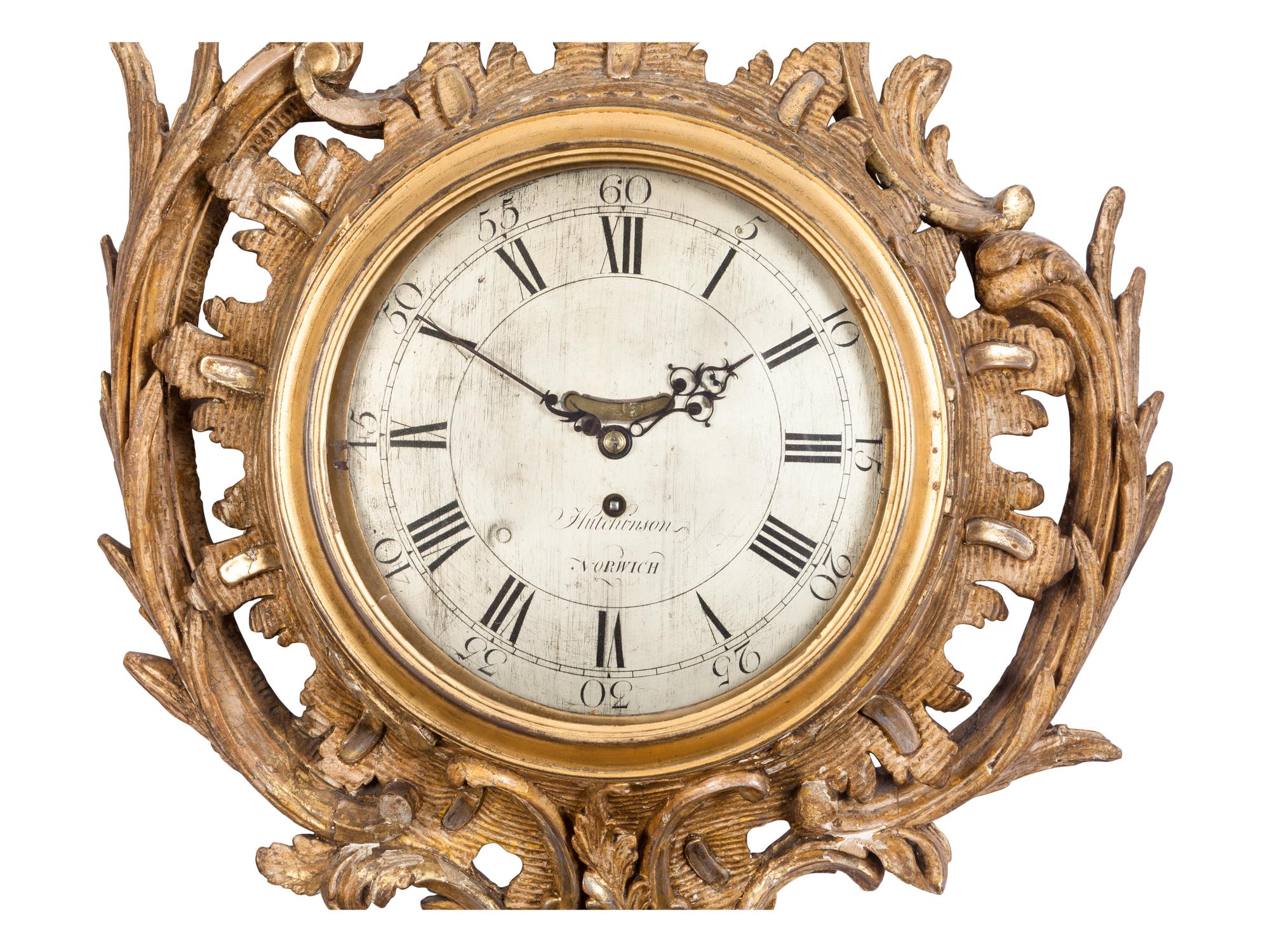 A George II Carved Giltwood Cartel Clock