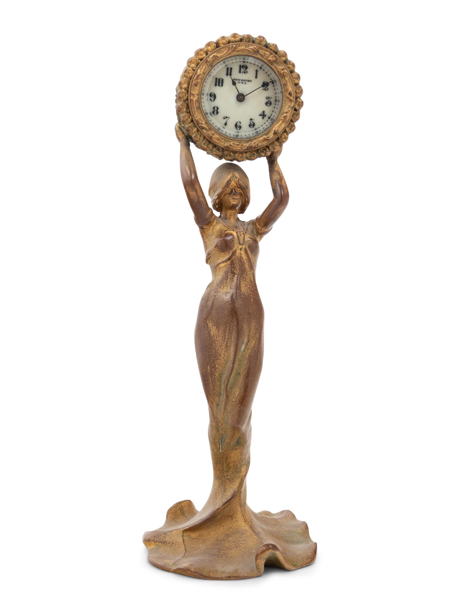 A New Haven Clock Co. Gilt Metal Figural Table Clock