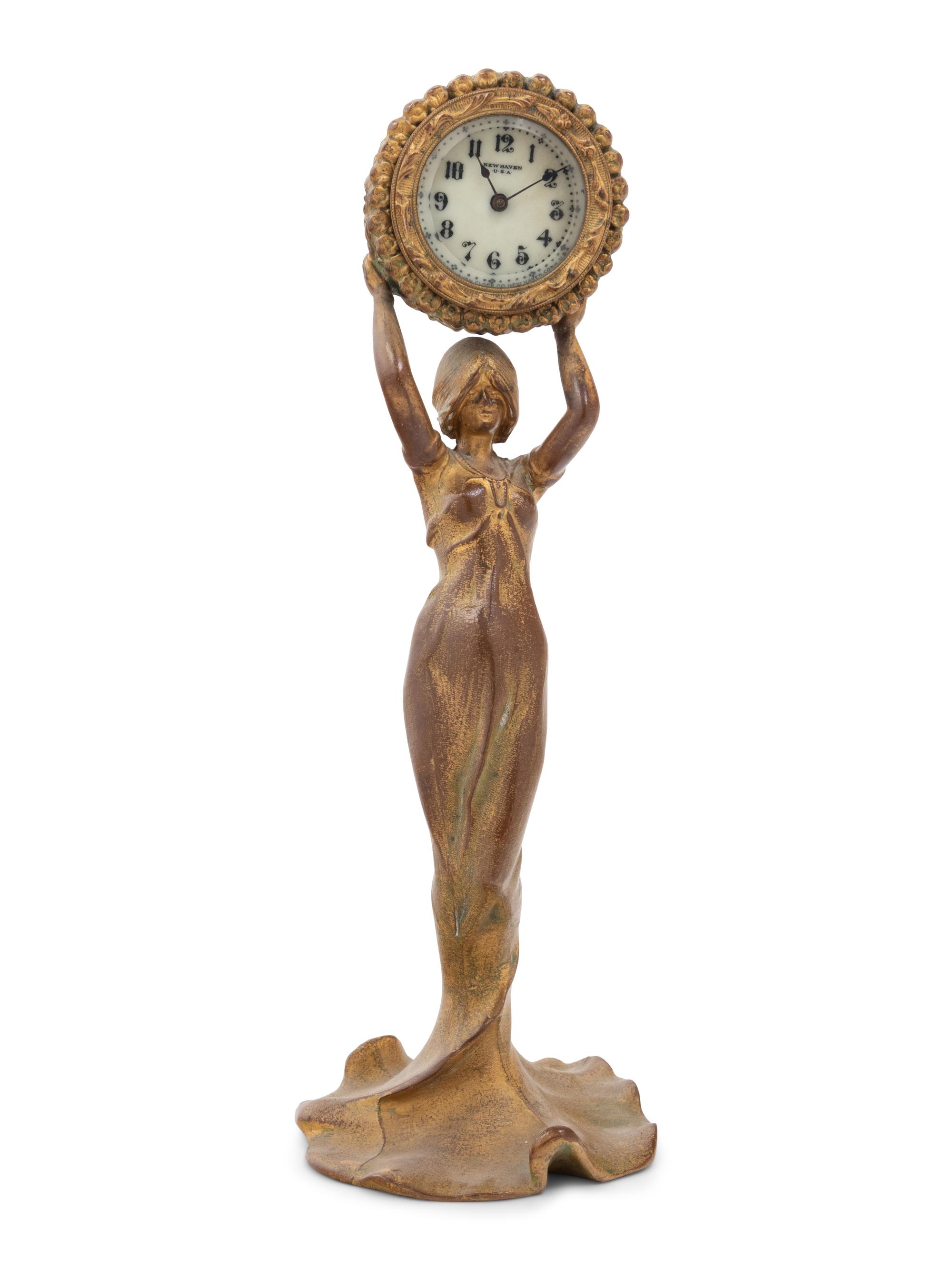 A New Haven Clock Co. Gilt Metal Figural Table Clock