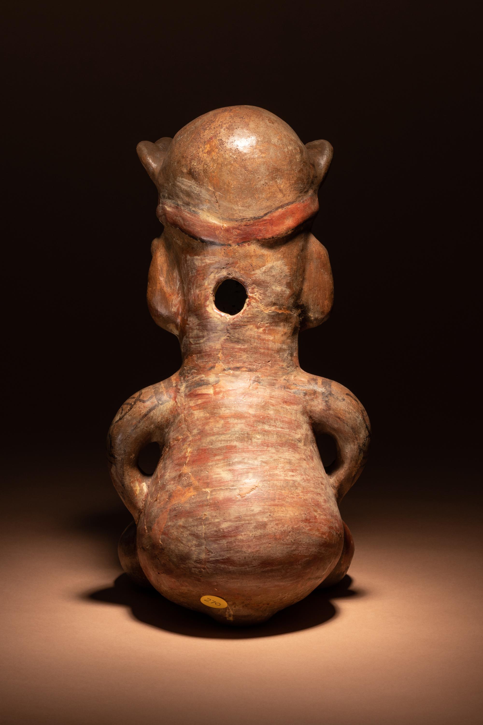 A Nicoya Polychrome Terracotta Seated Figure